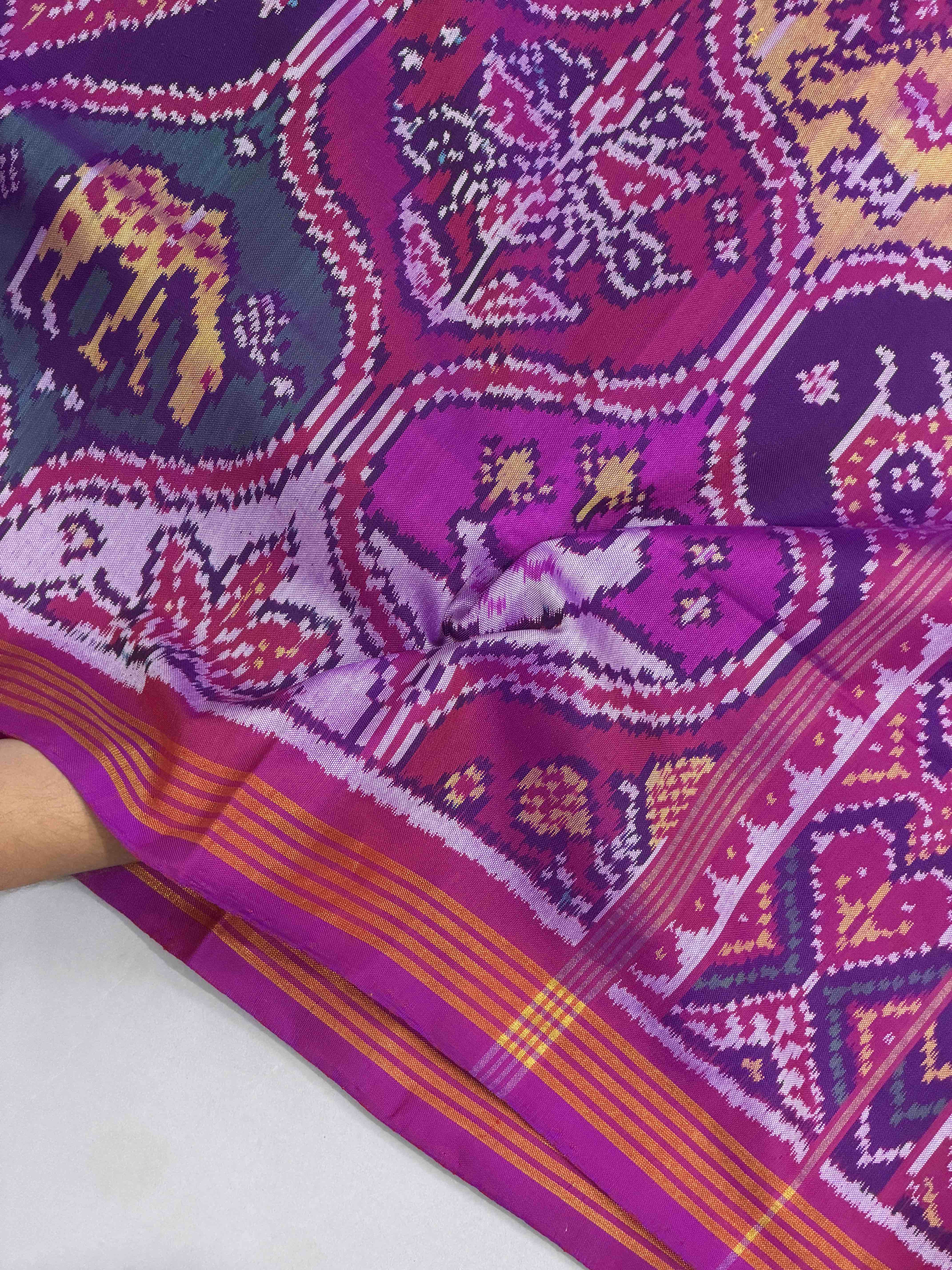 Magenta with multiple figures Patola Saree