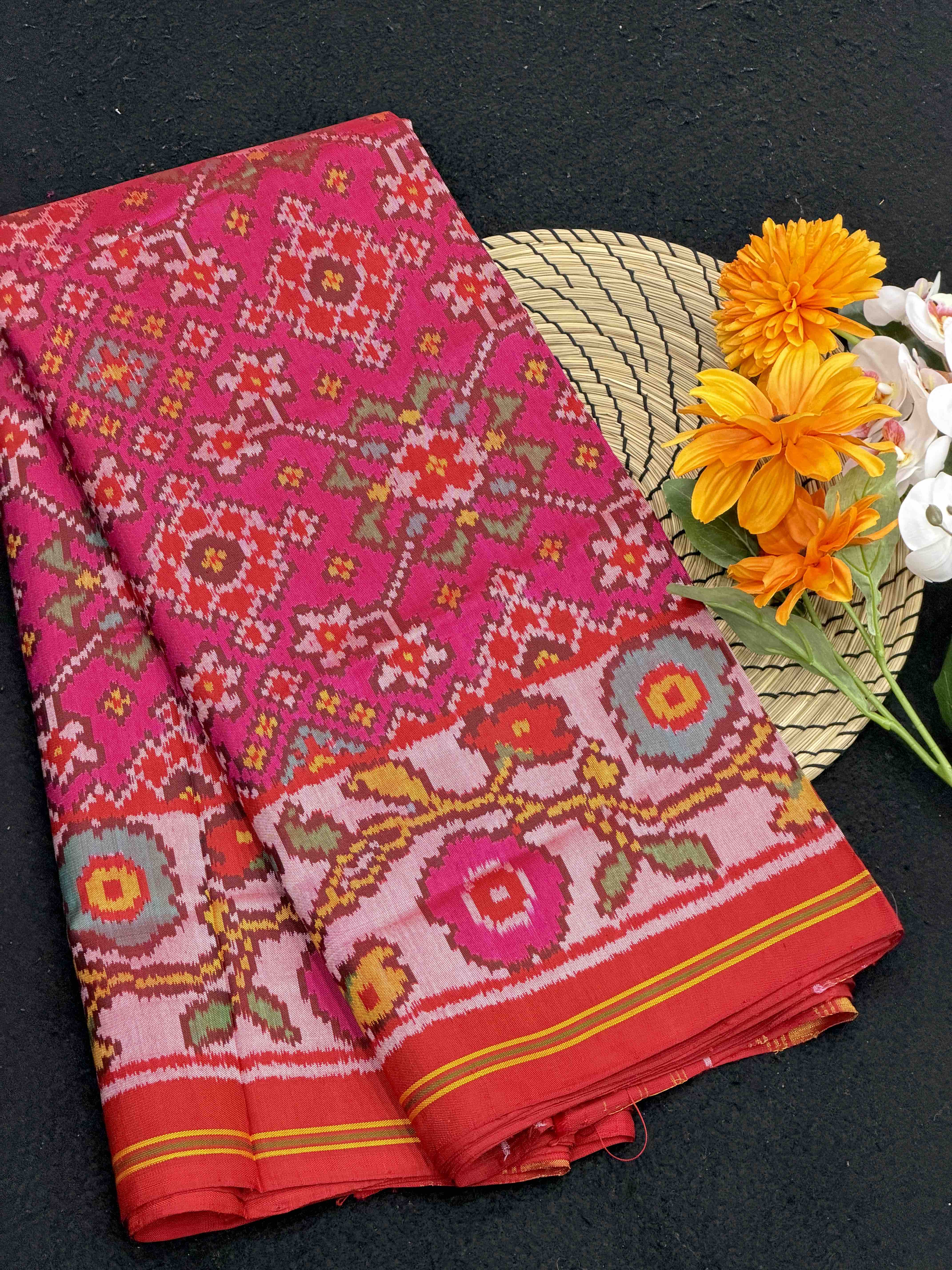 Offwhite flowers border with pink navratan Patola Saree