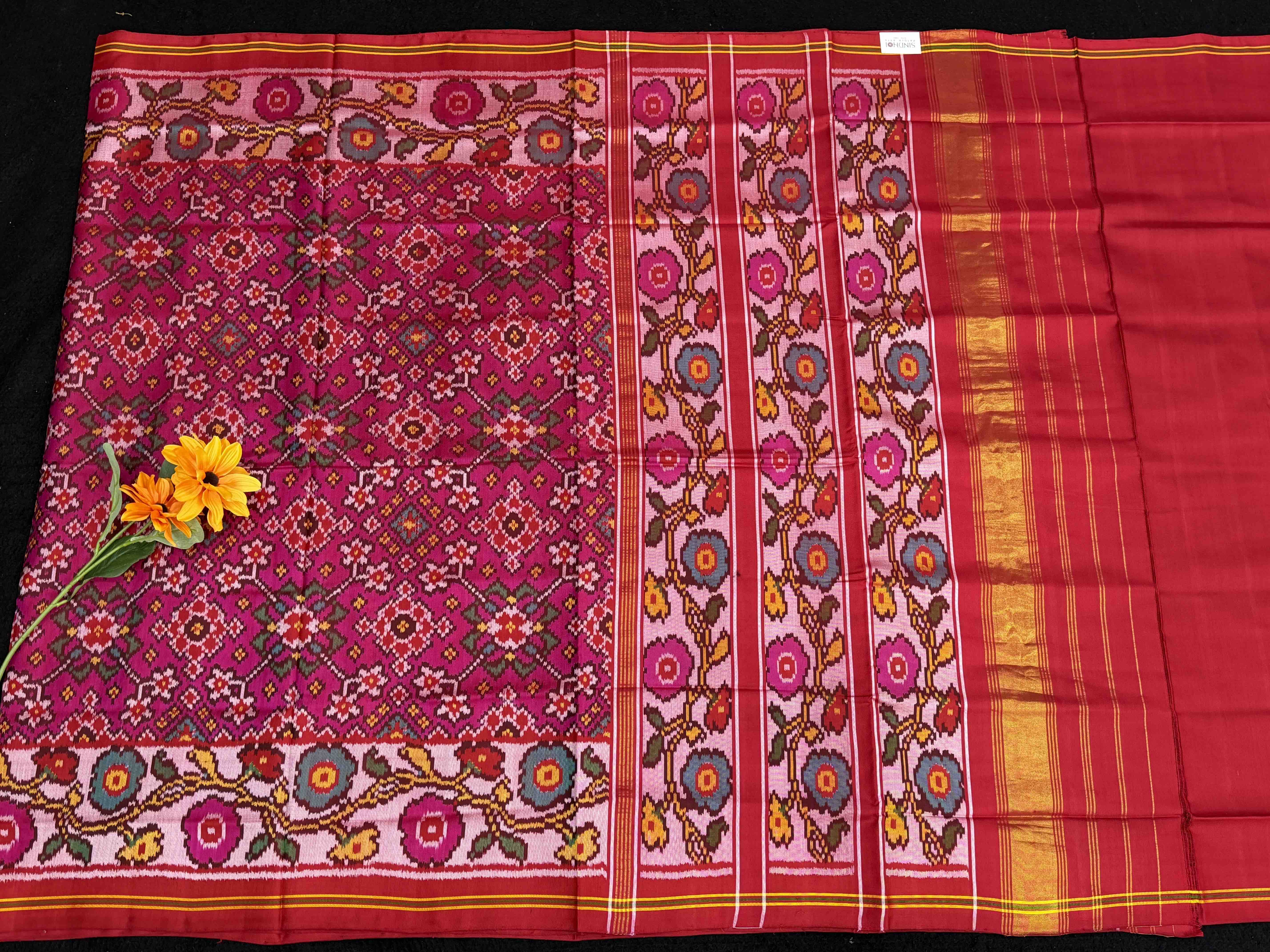 Offwhite flowers border with pink navratan Patola Saree