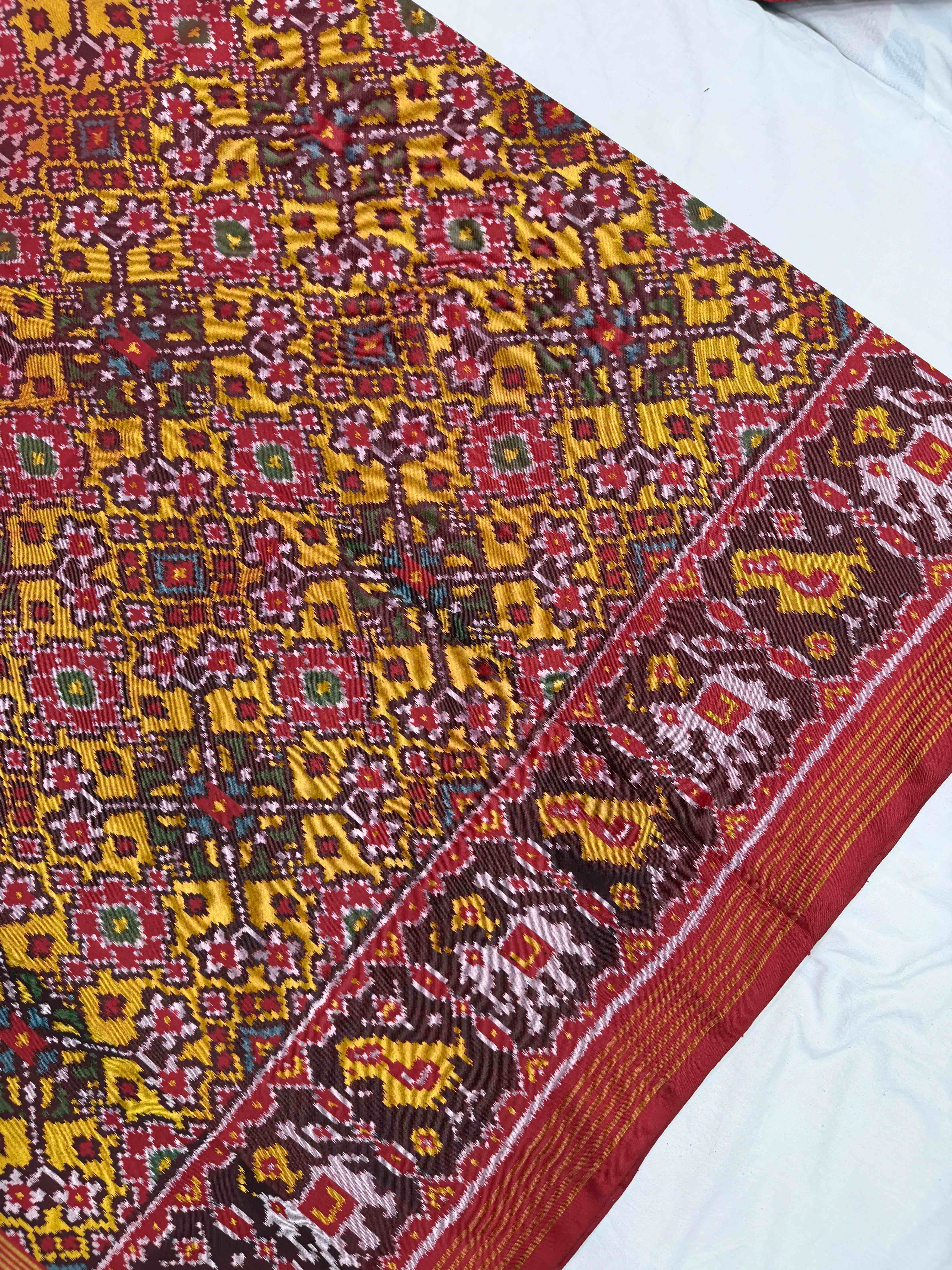 Red narikunj border pallu & musterd navaratn Patola Saree