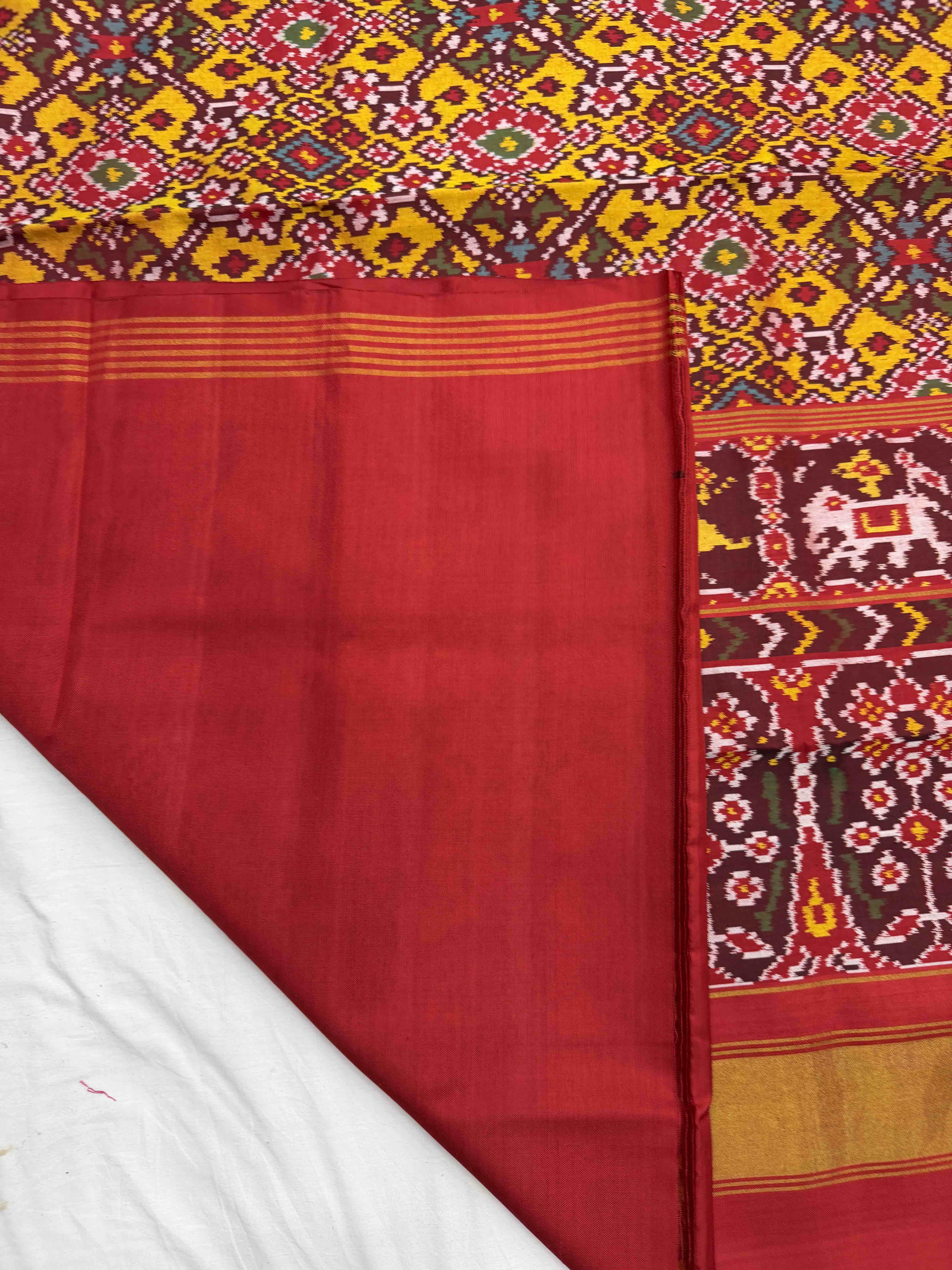 Red narikunj border pallu & musterd navaratn Patola Saree