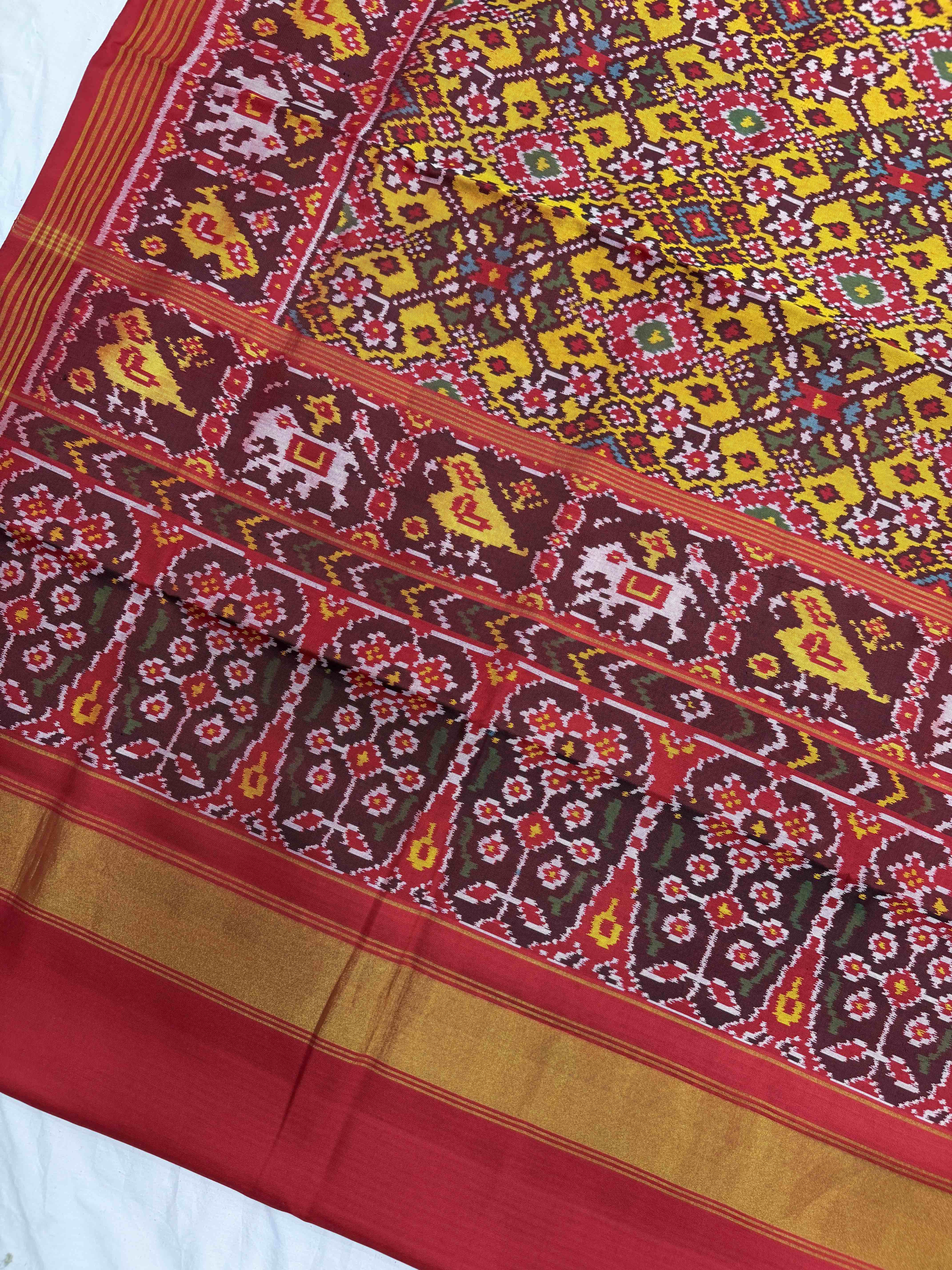 Red narikunj border pallu & musterd navaratn Patola Saree