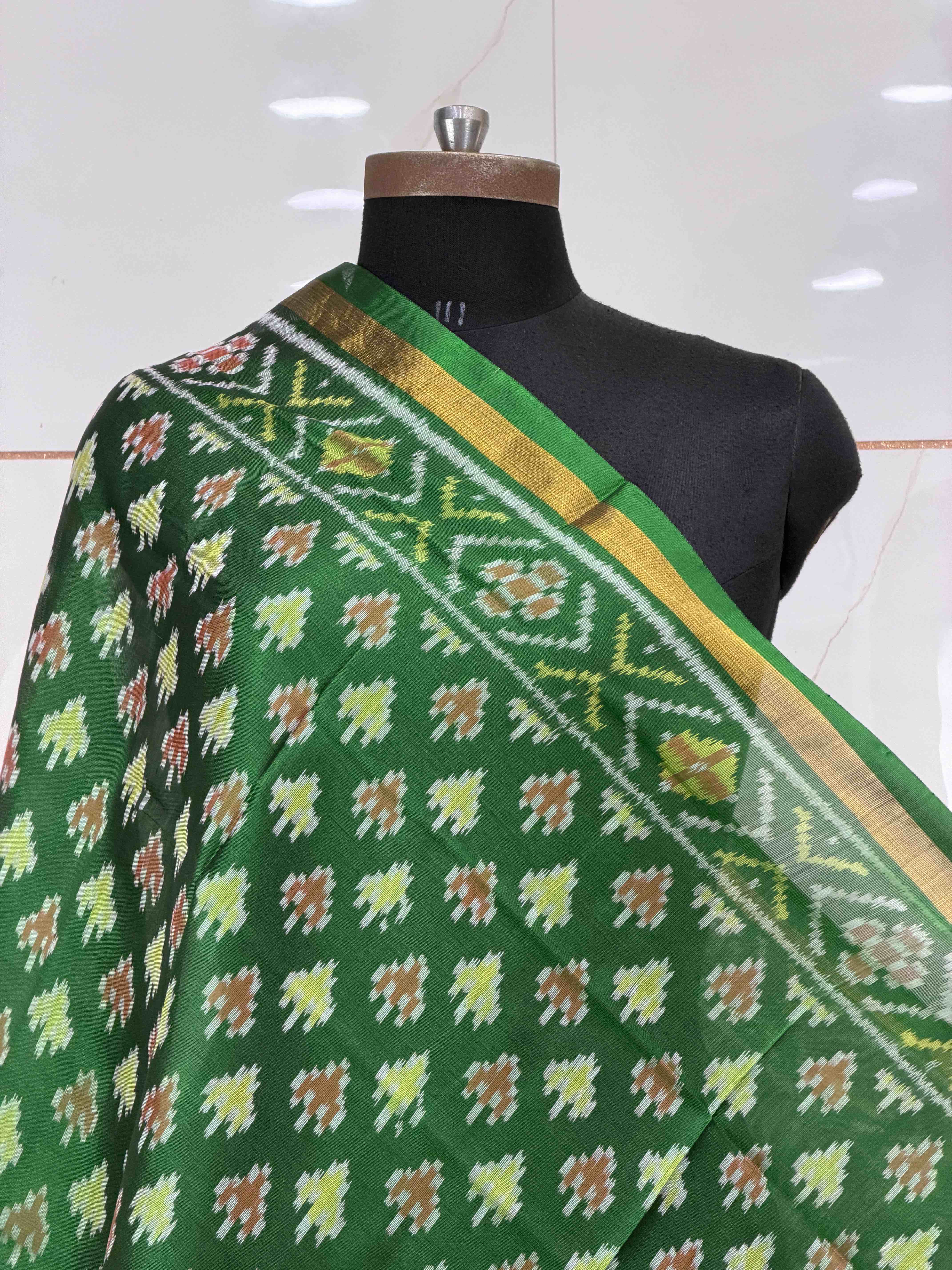 Small dupatta in green shade woven in single ikat