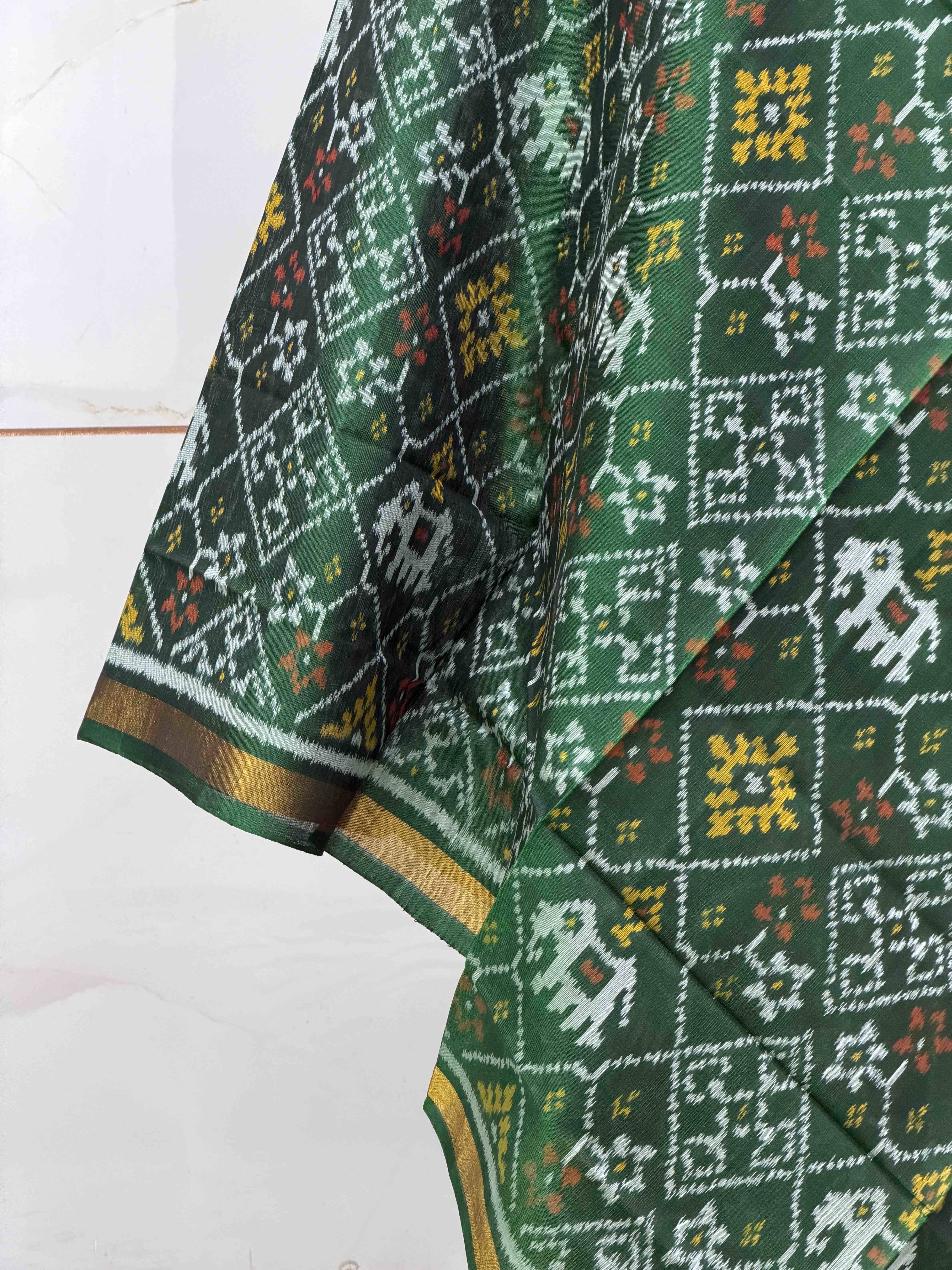 Small dupatta in Green shade single ikat woven.