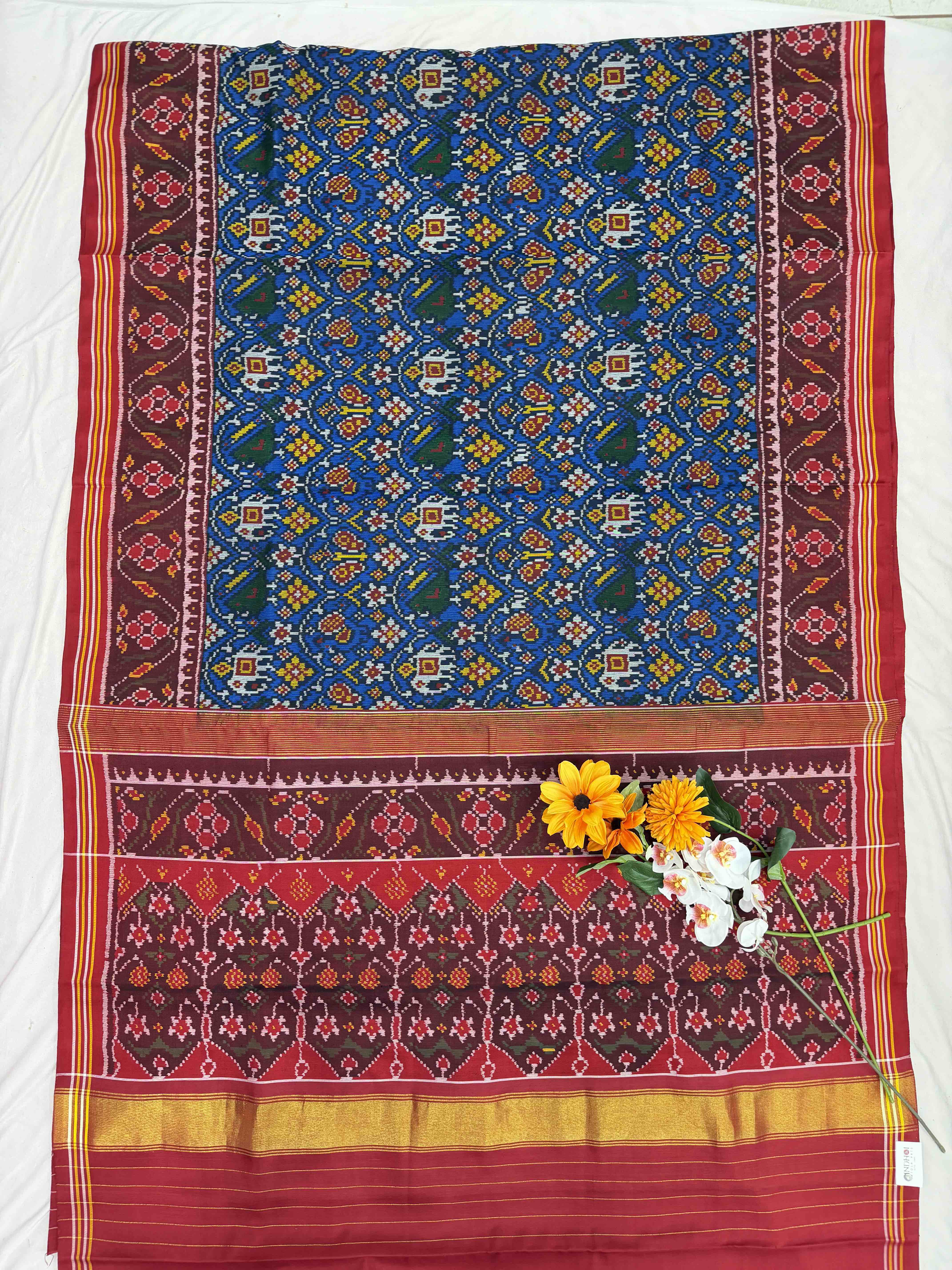 Maroon & Blue floral figure single ikat Patola