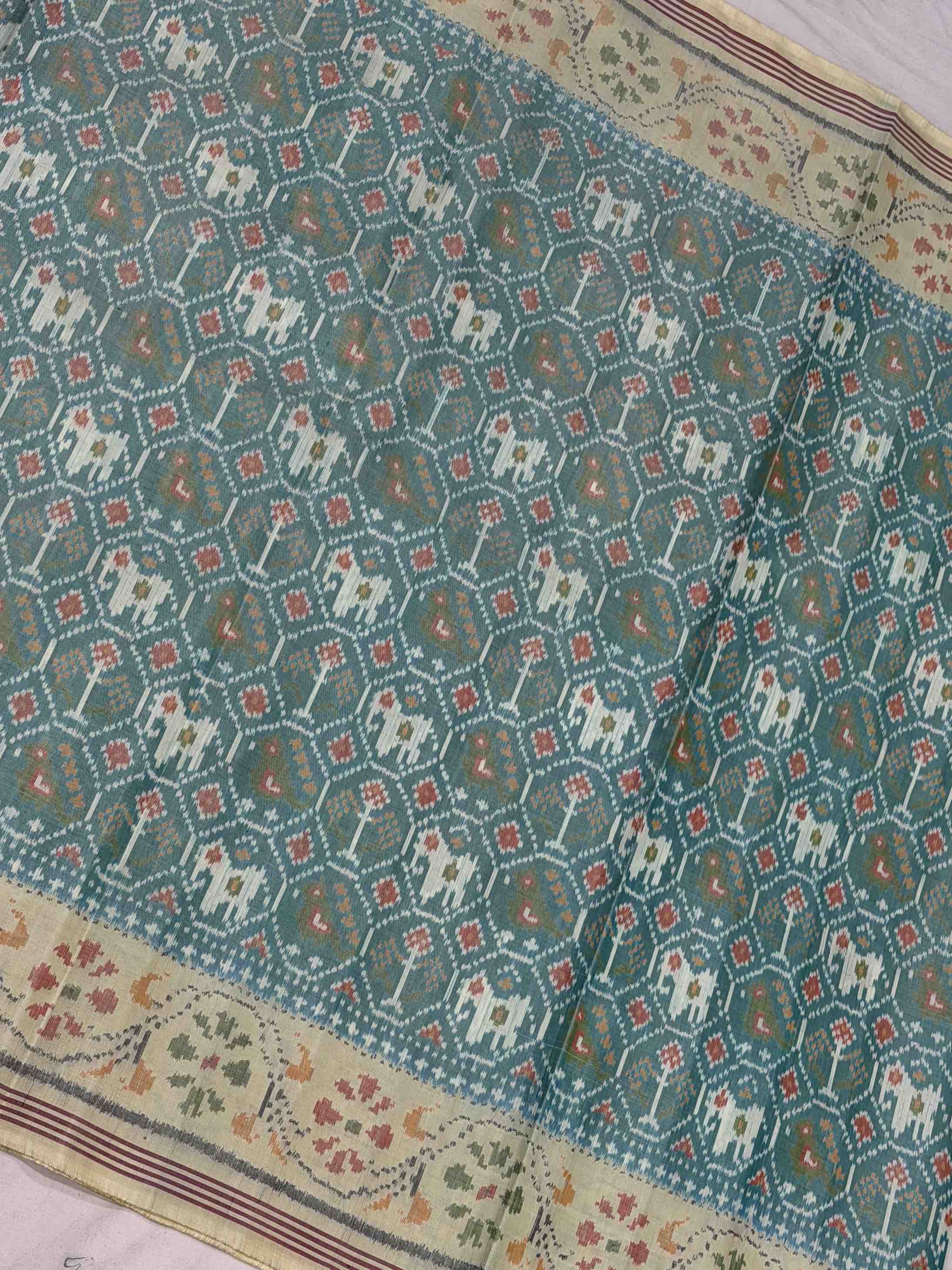 Off white & light Sea Green Narikunj Singe Ikat Patola Sarees