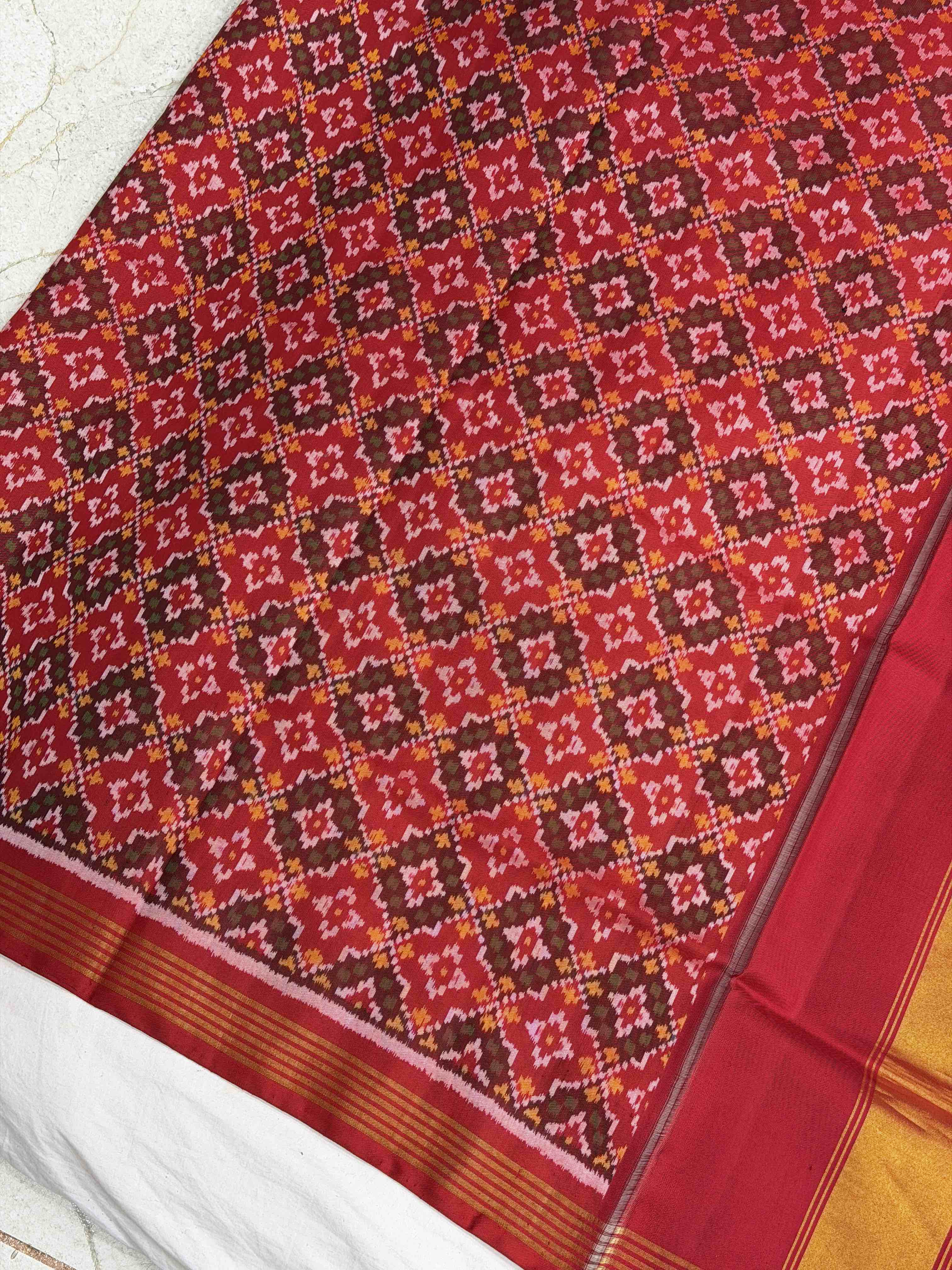 Red & teal skirt border button ful single ikat patola saree