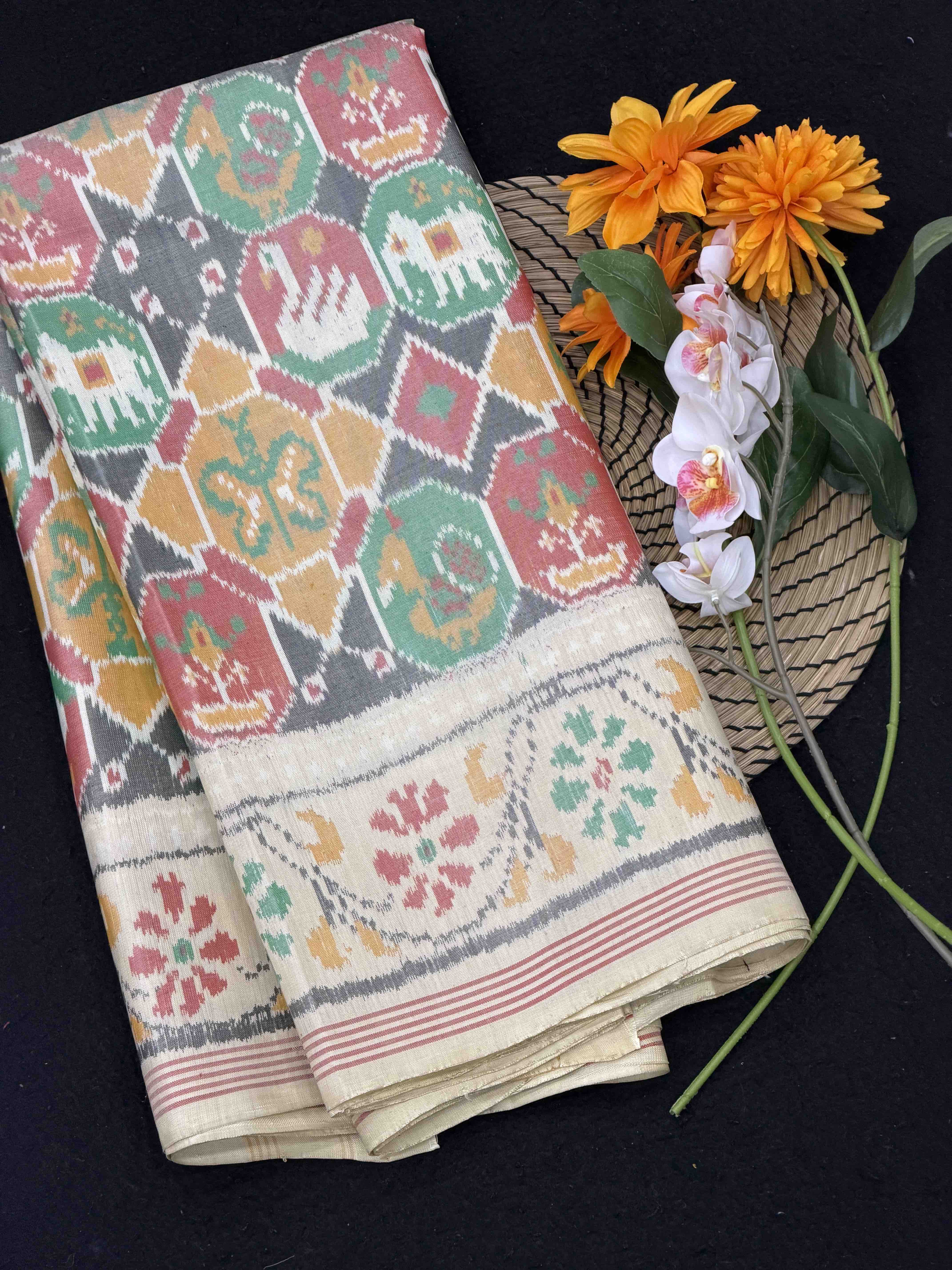 Cream white with multi figures Single Ikat Patola Saree