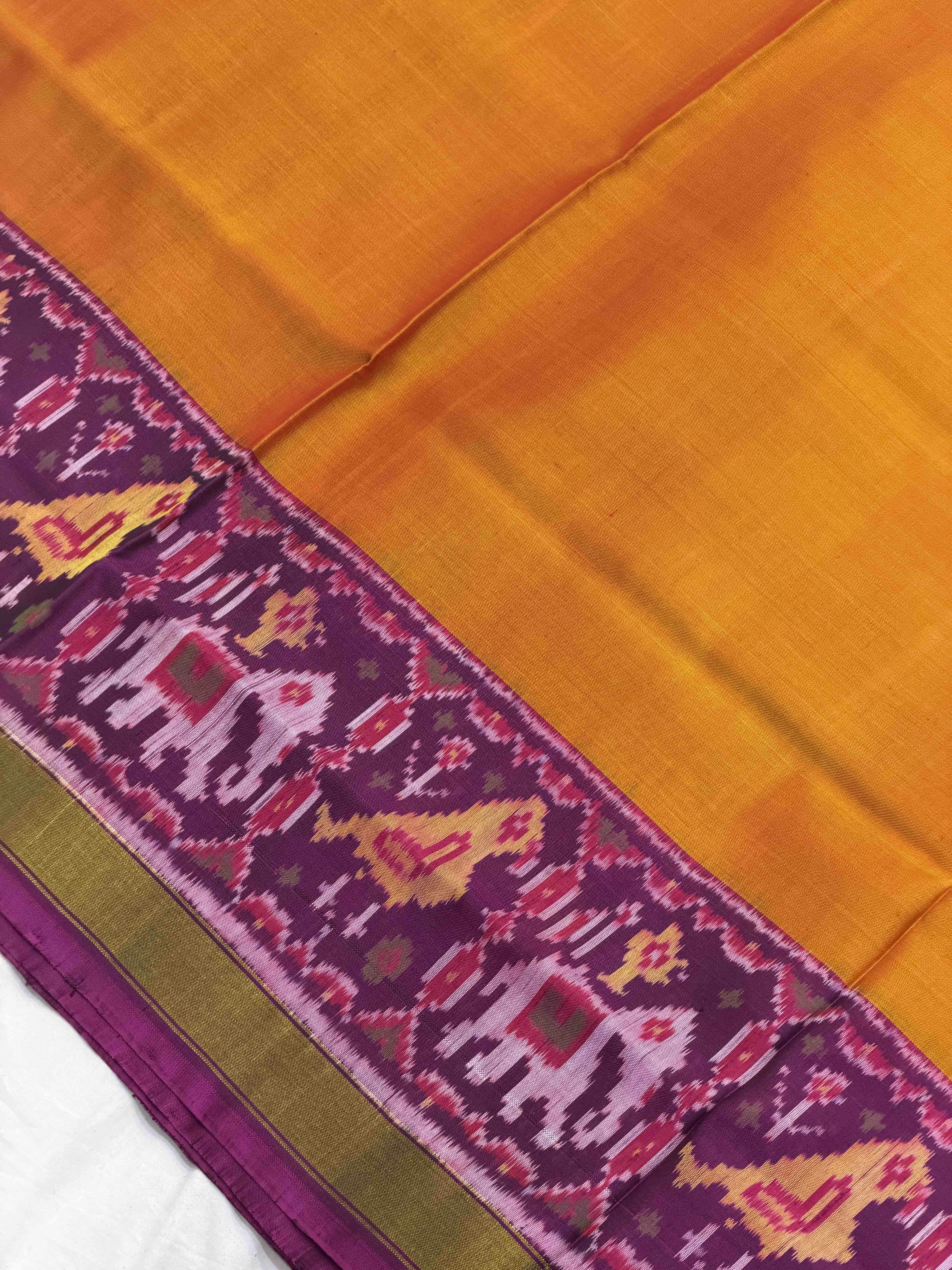 Magenta Narikunj Pallu & plain orange gala border Patola Saree