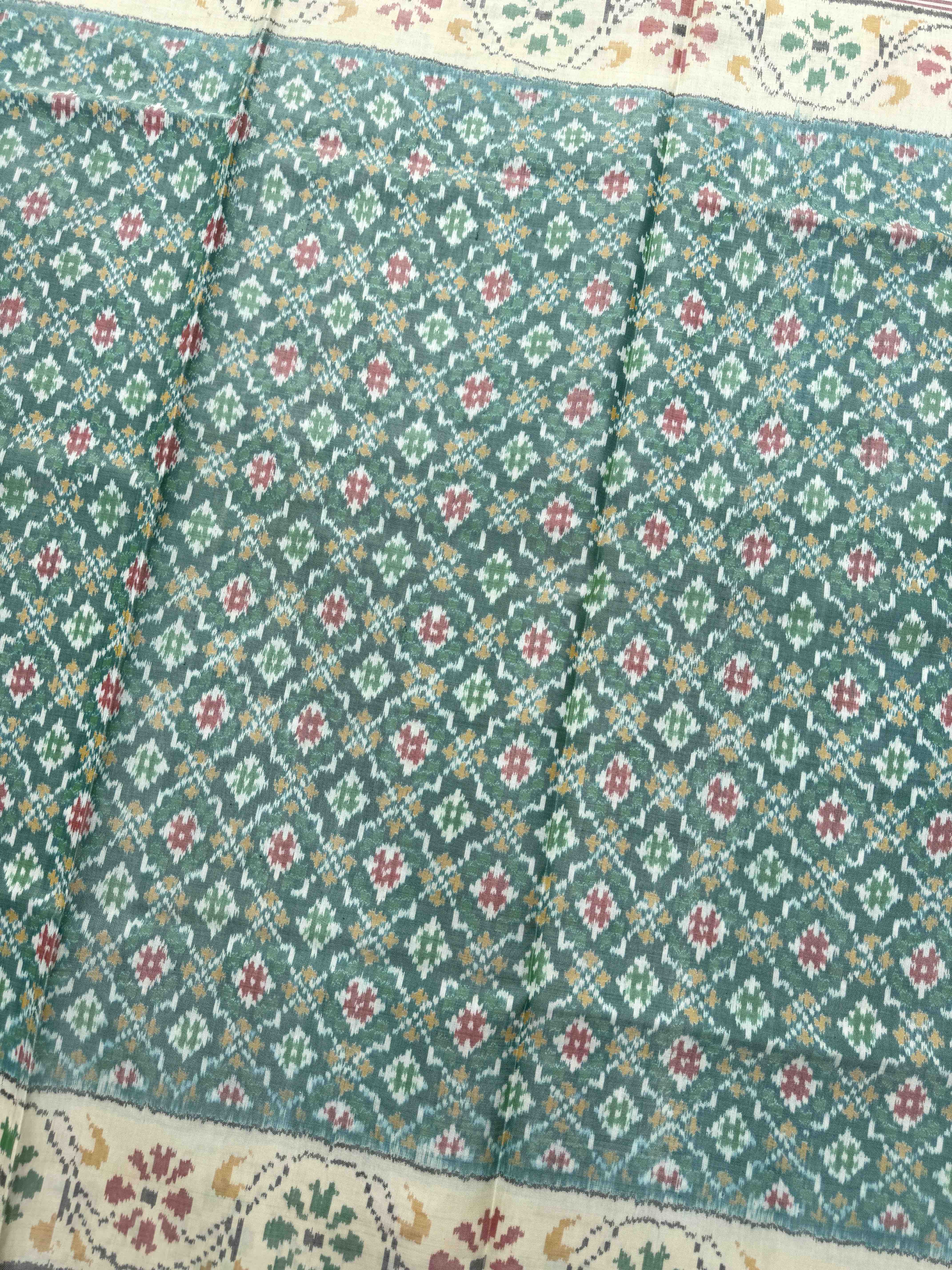 Off White & Sea Green Buttonful Single Ikat Patan Patola Saree