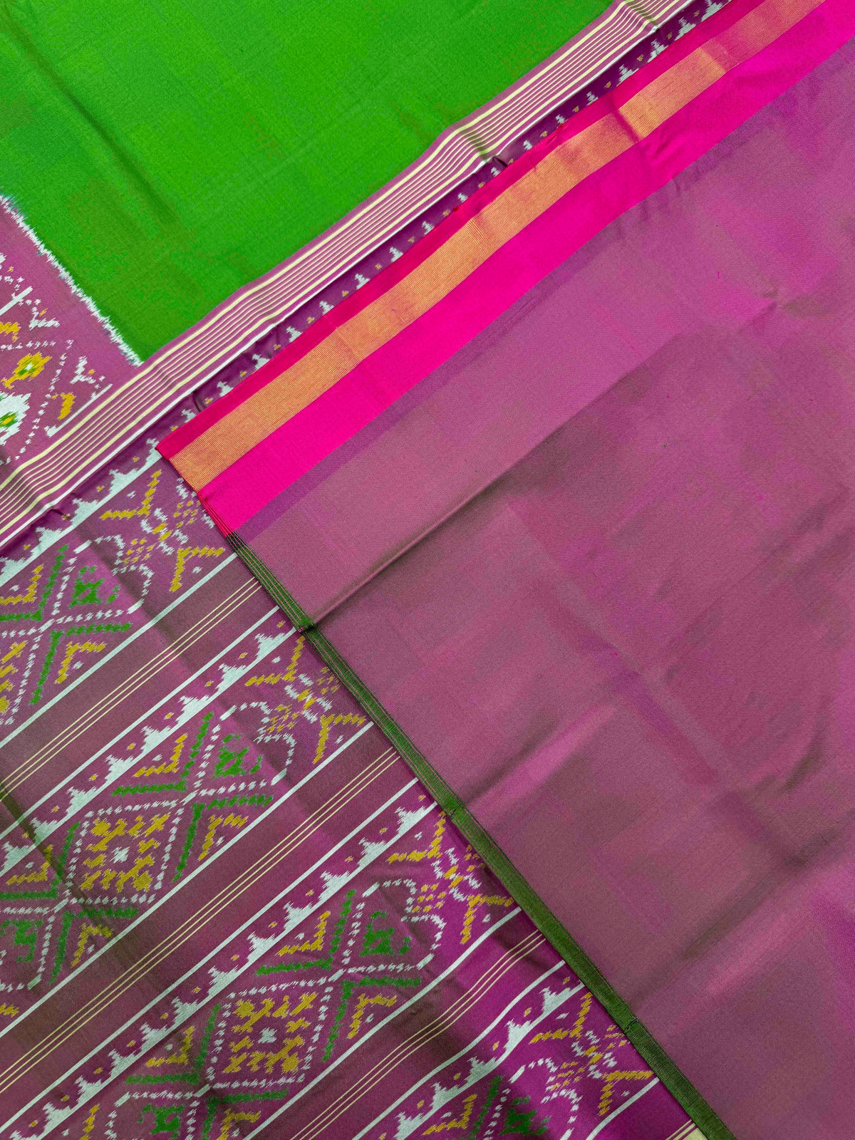 Pink & Green Plain with Narikunj Scut Border Rajkot Patola Saree