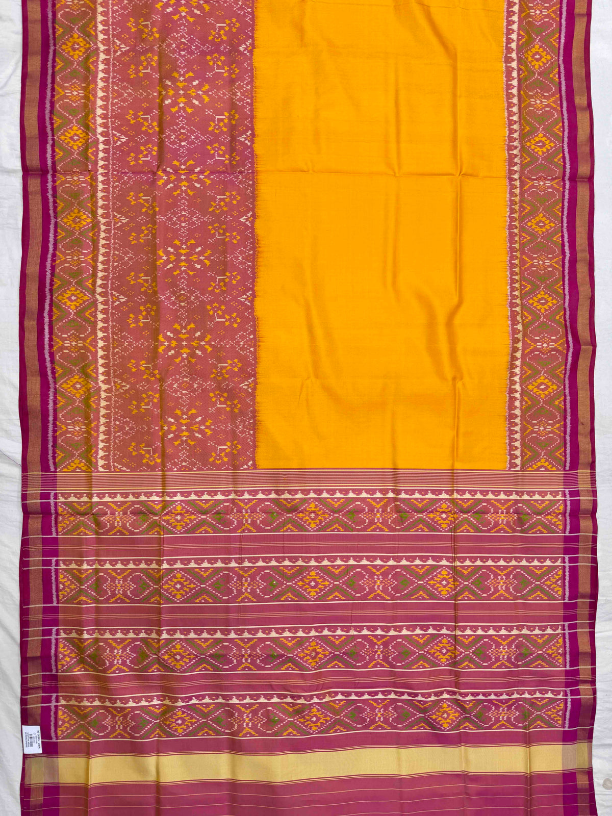Peach & Yellow Plain with Navratan Scut Border Rajkot Patola Saree