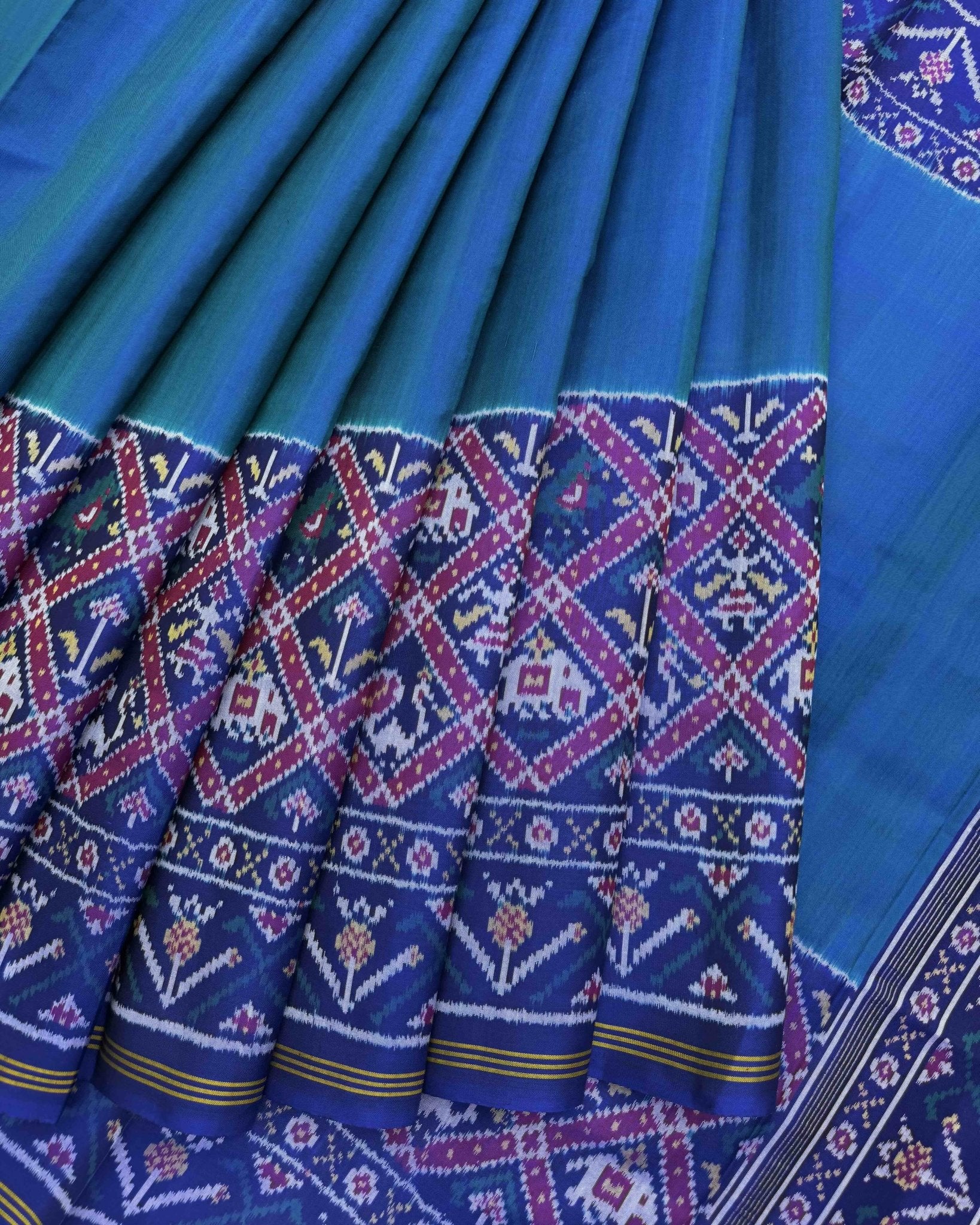 Blue & Turquoise Plain with Narikunj Scut Border Semi Double Ikat Patola Saree - SindhoiPatolaArt