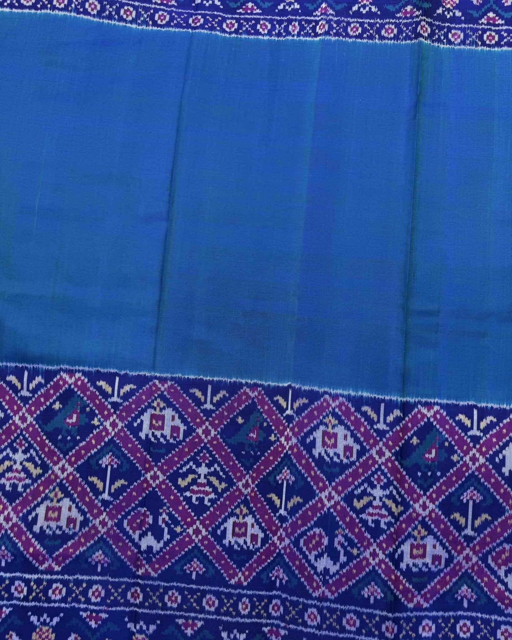 Blue & Turquoise Plain with Narikunj Scut Border Semi Double Ikat Patola Saree - SindhoiPatolaArt