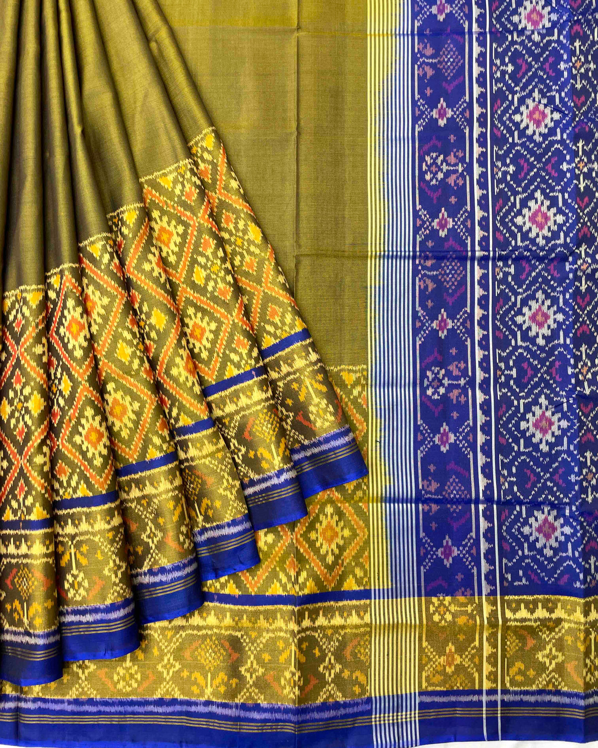 Blue & Mehendi Plain with Panchanda Scut Border Patola Saree