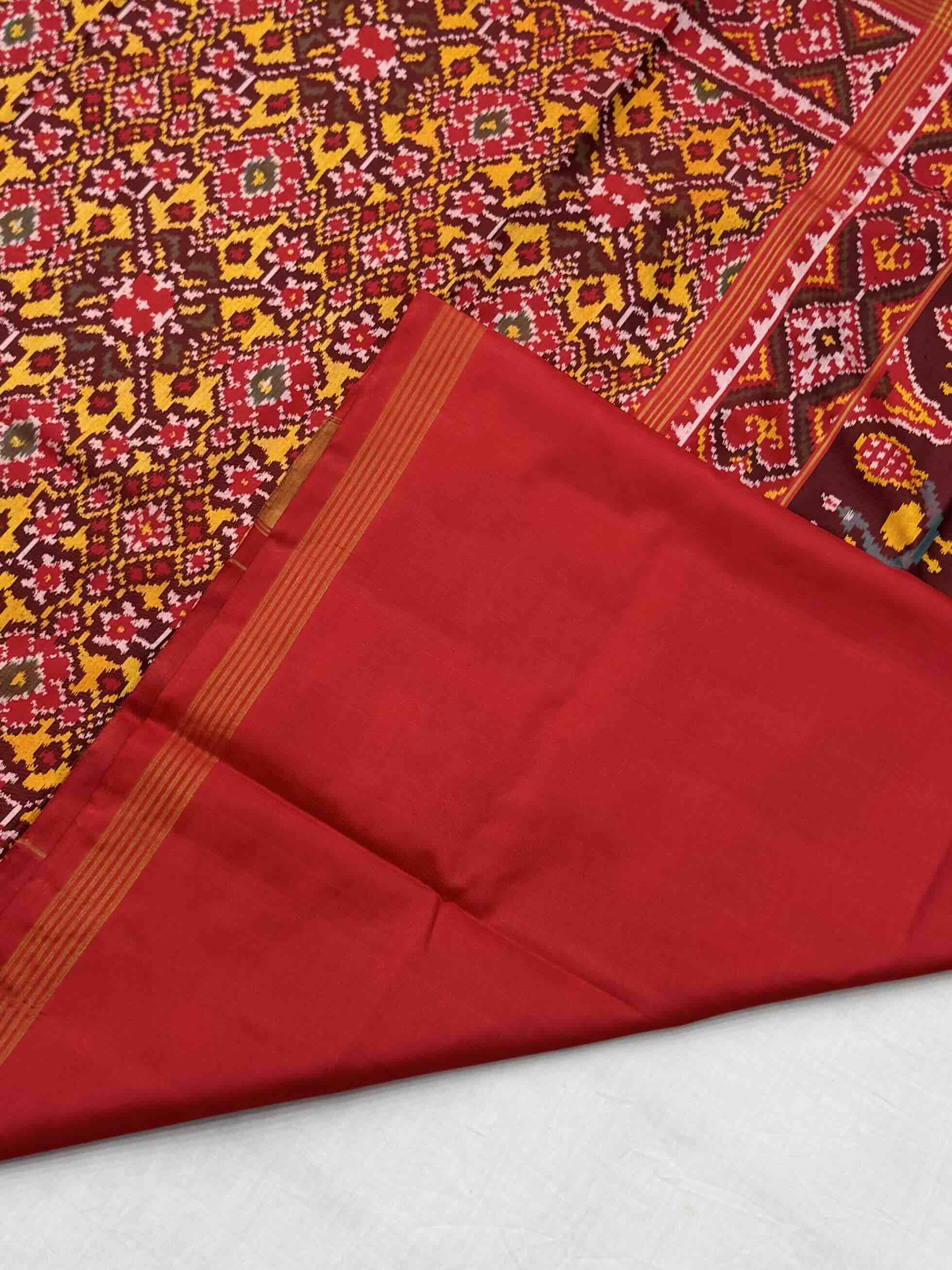 Red & musterd navratan Patola Saree