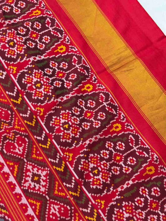 Red with multicolour figures in circle Patola Saree
