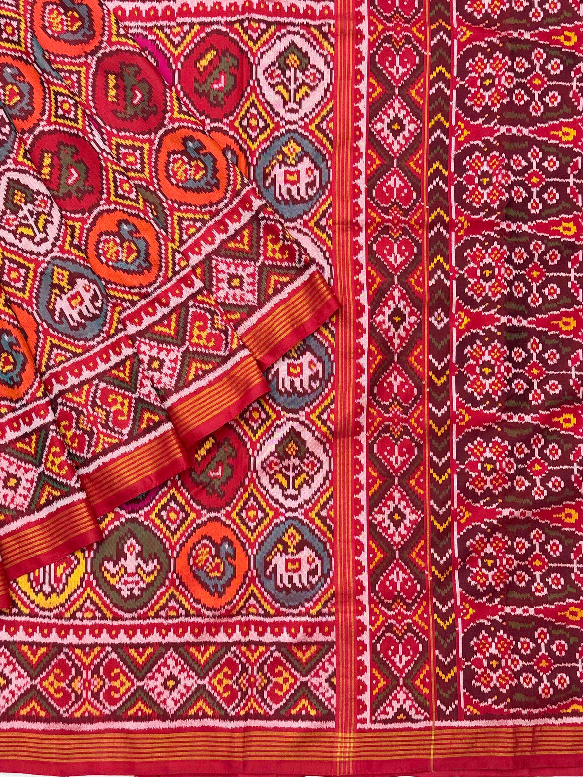 Red with multicolour figures in circle Patola Saree