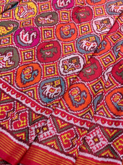 Red with multicolour figures in circle Patola Saree