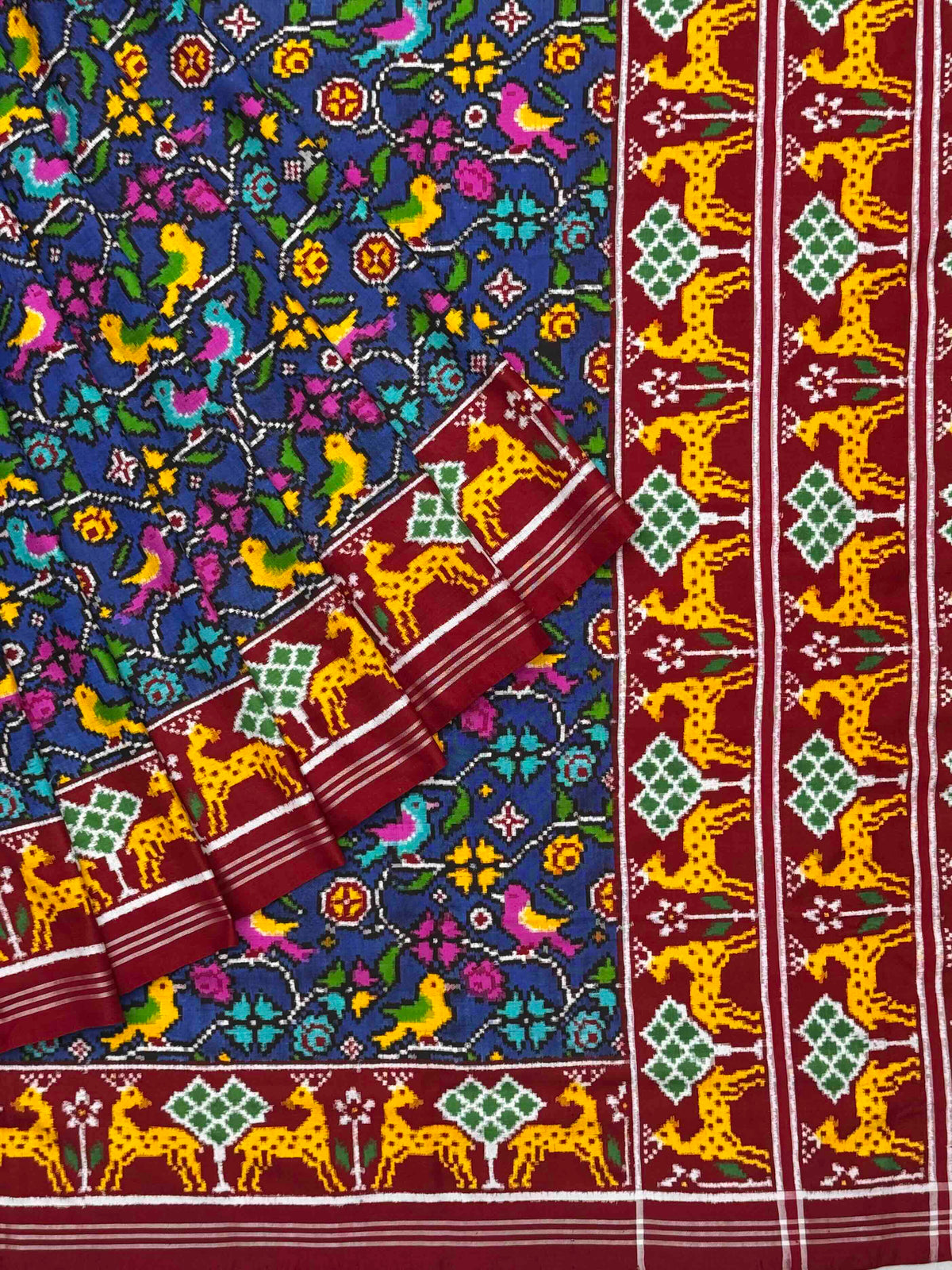 Red & Blue deer border pallu with blue patan patola