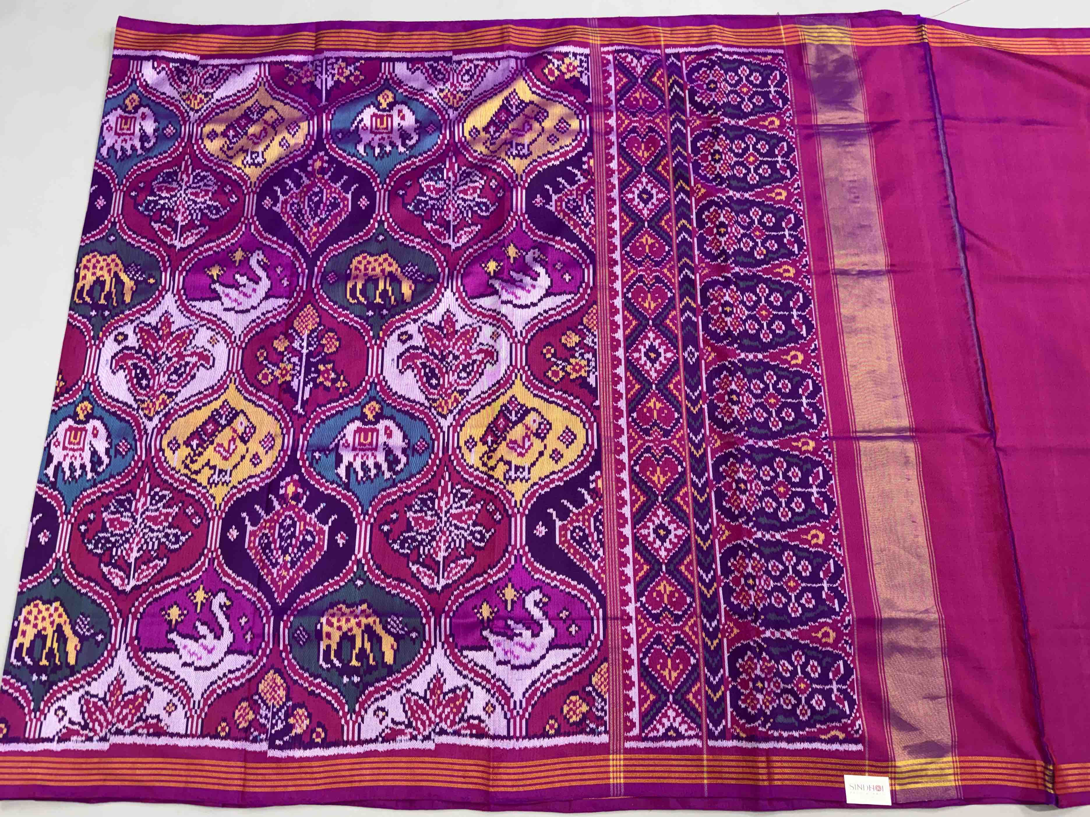 Magenta with multiple figures Patola Saree