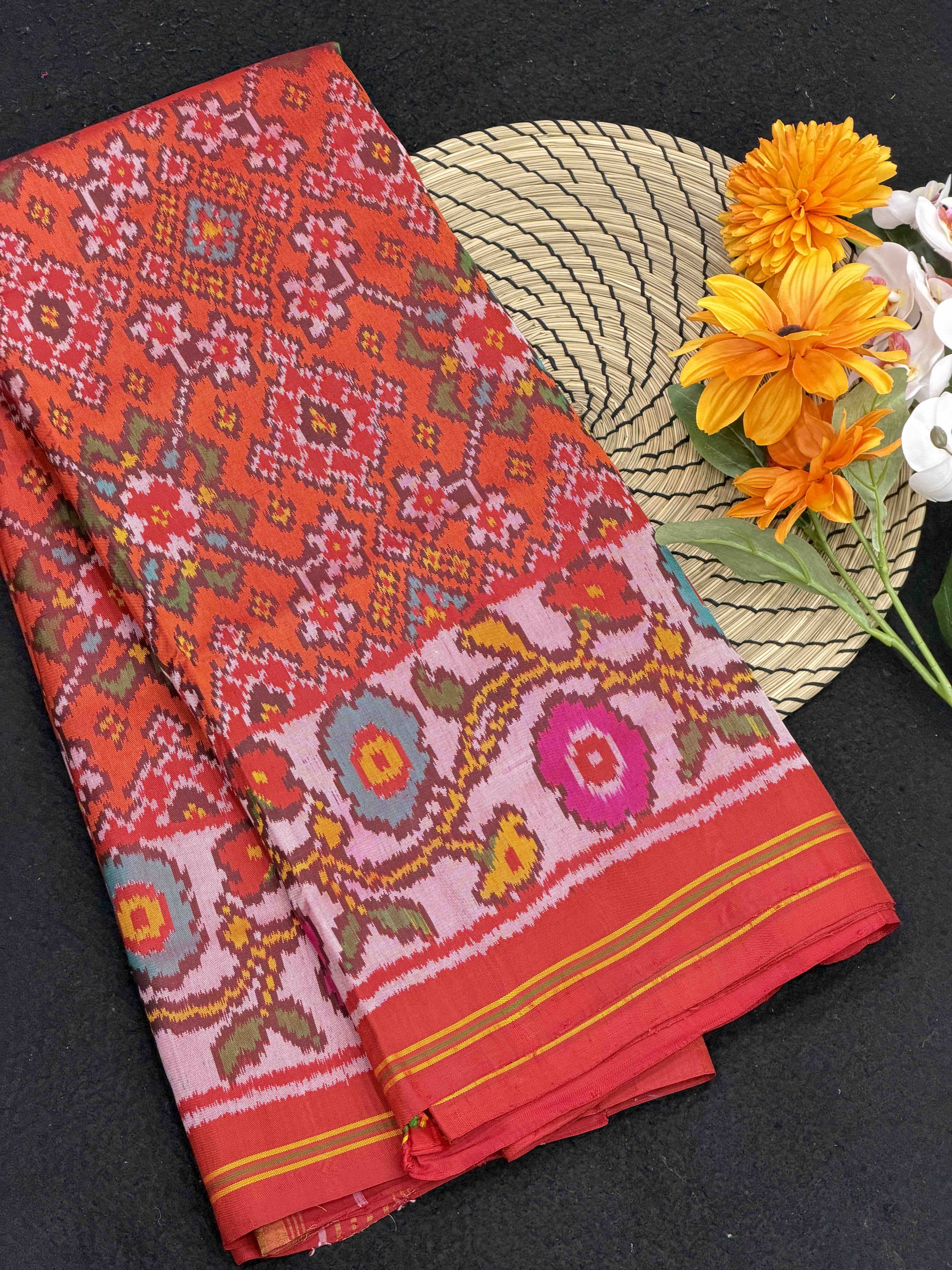 Offwhite Flowers border with orange red Navaratn Patola