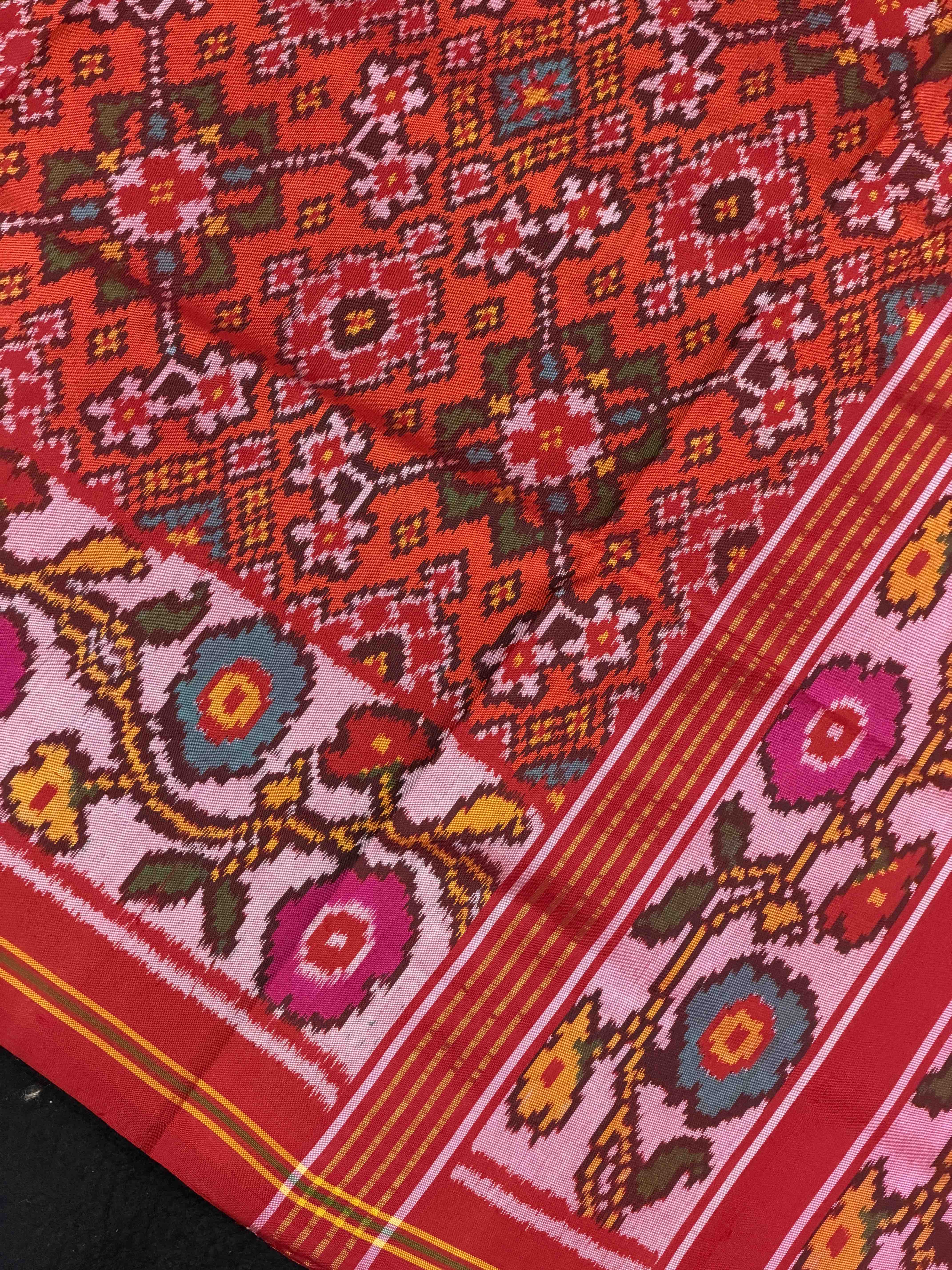 Offwhite Flowers border with orange red Navaratn Patola