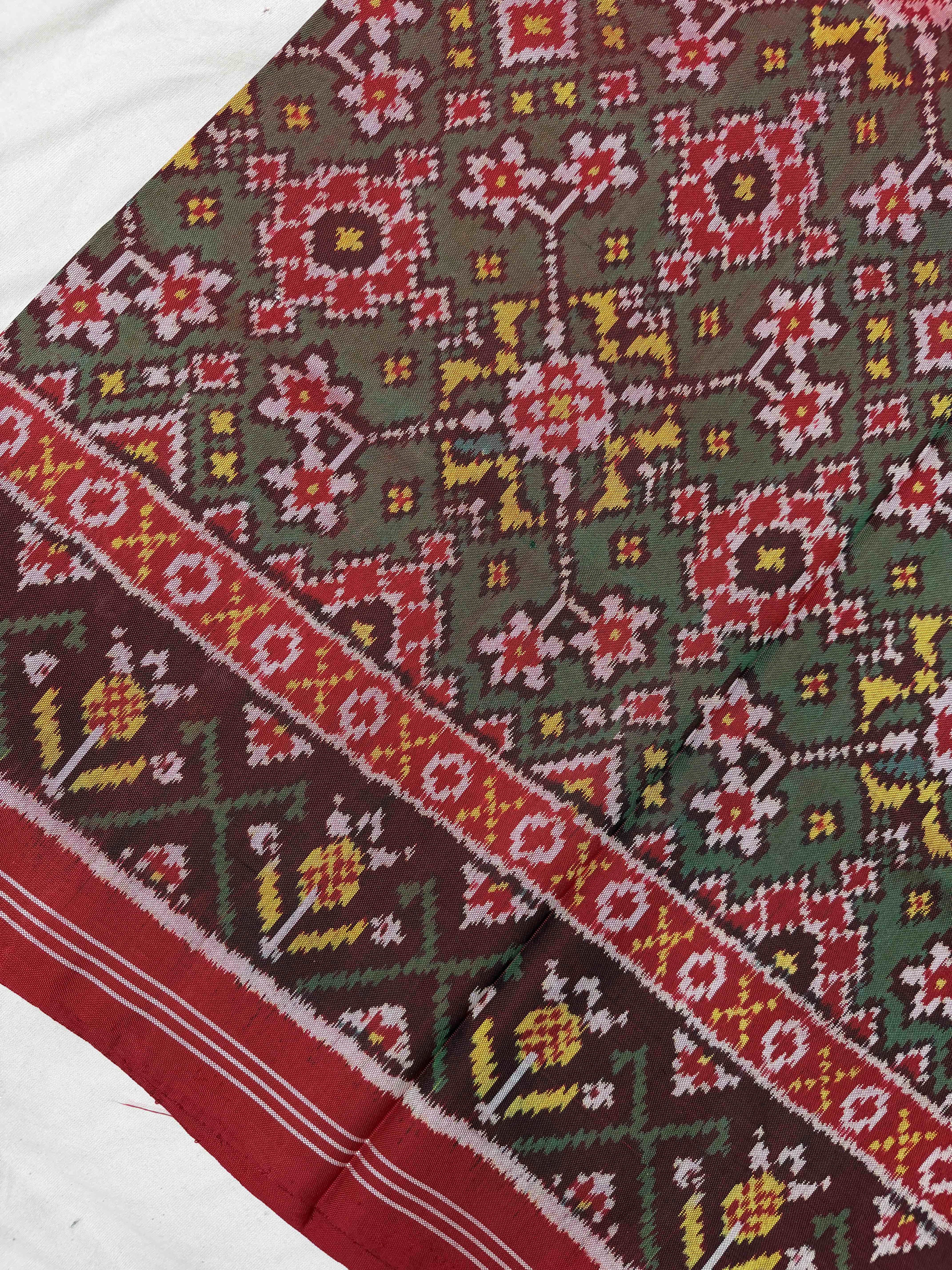 Red & shaded green Navaratan Patola Saree