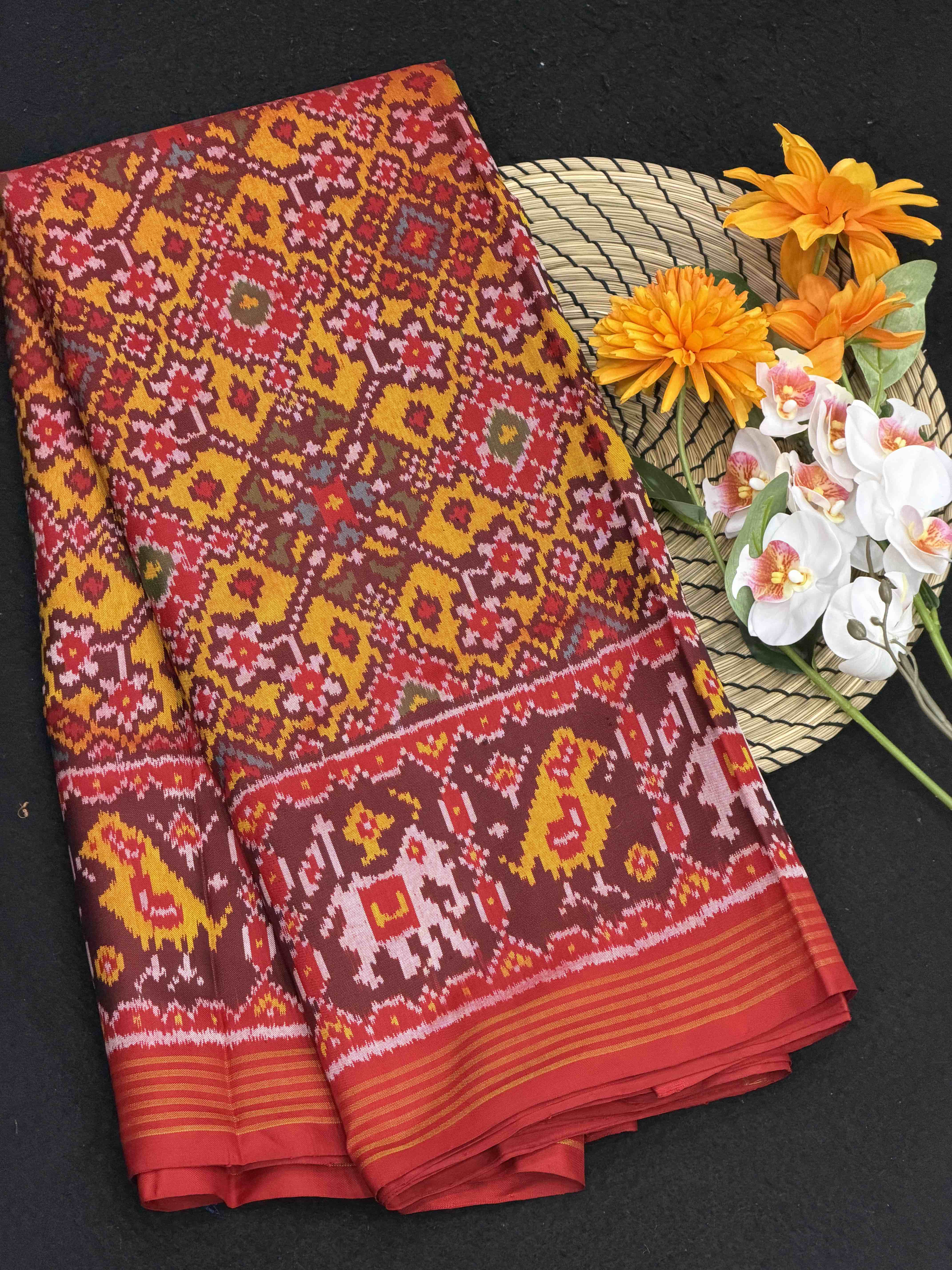 Red narikunj border pallu & musterd navaratn Patola Saree
