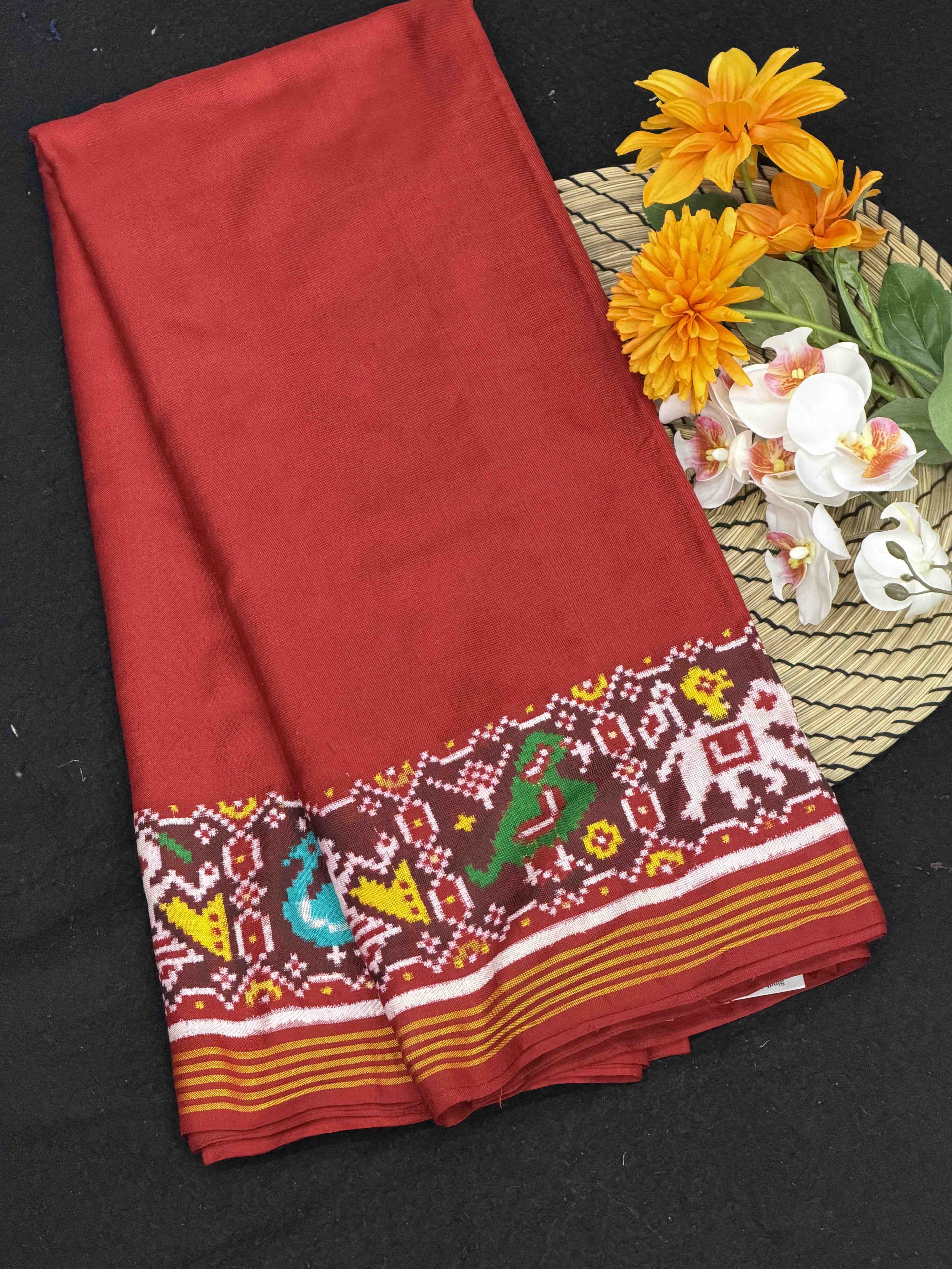 Red plain Patan Patola with narikunj border pallu