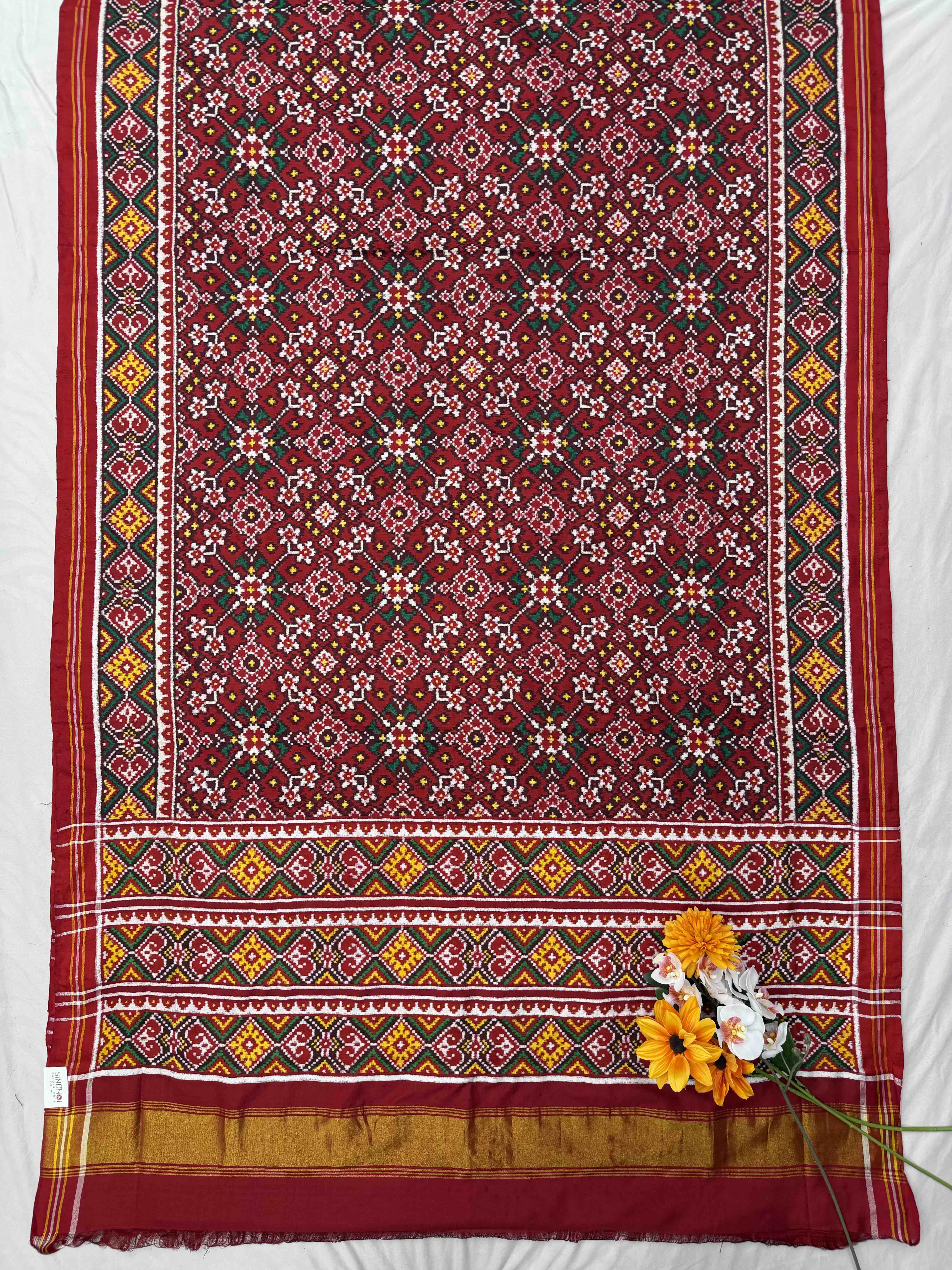 Traditional Maroon navaratan Patola saree