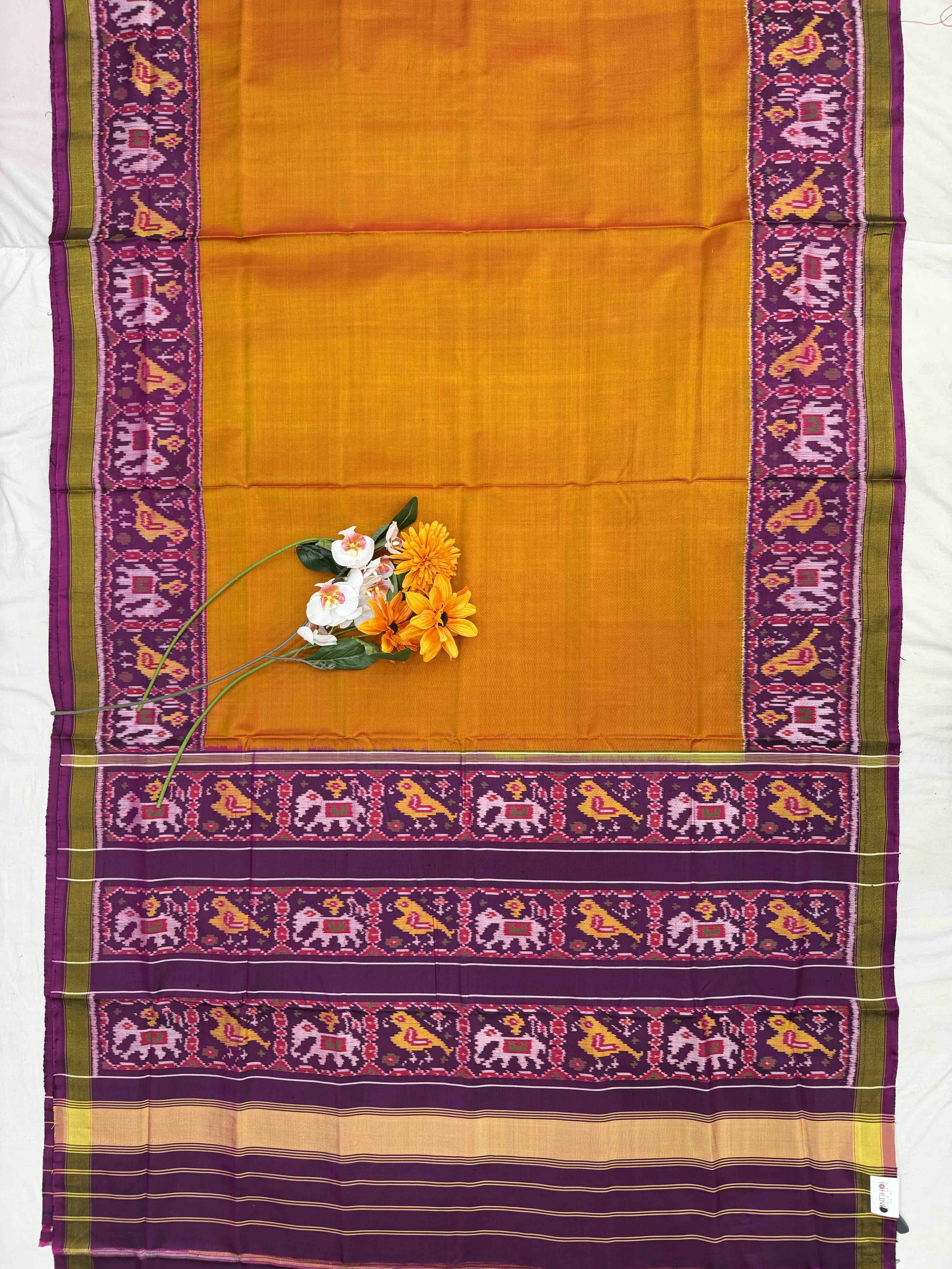 Magenta Narikunj Pallu & plain orange gala border Patola Saree