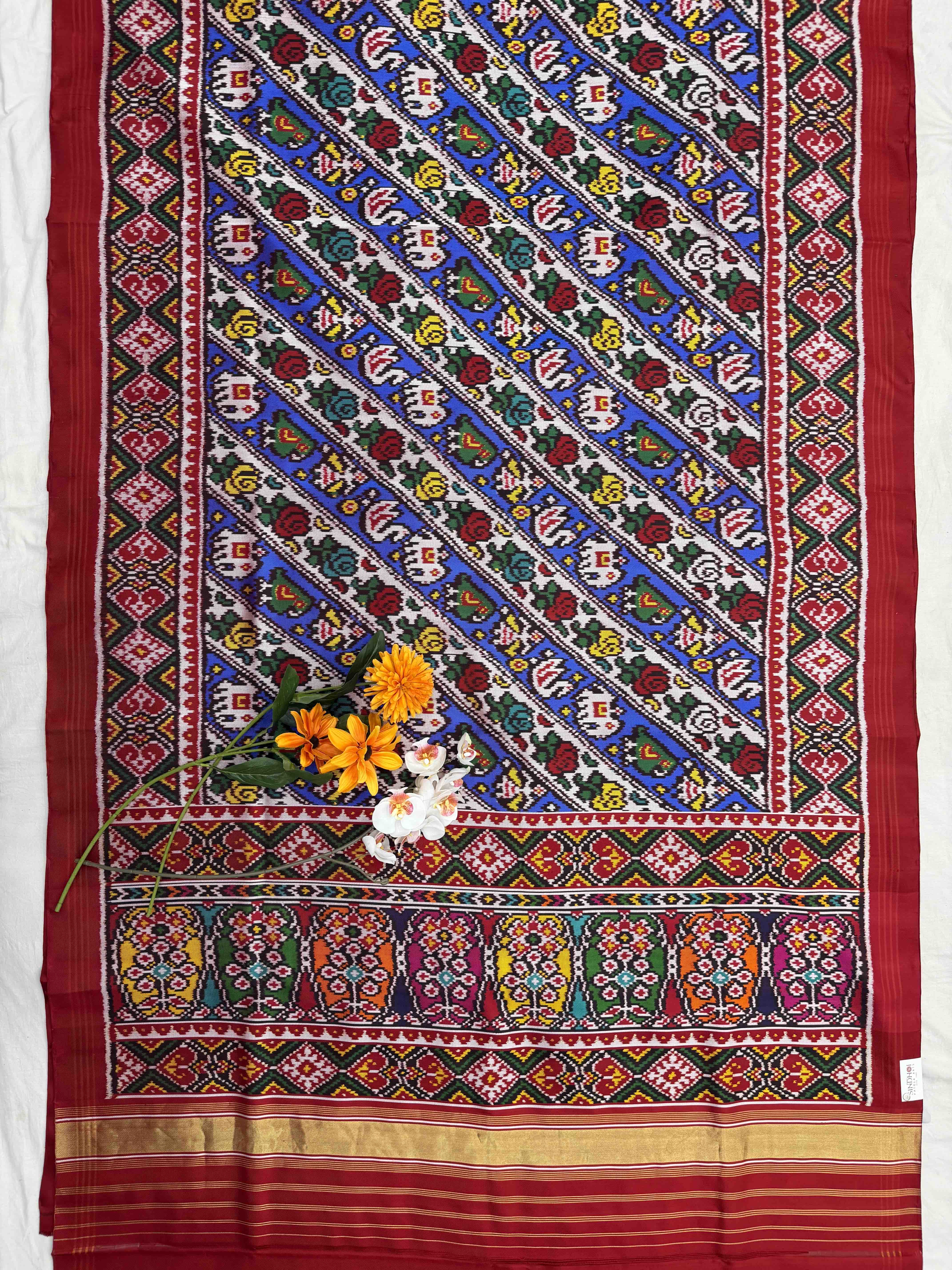Narikunj with rose petals multicolour twill Patola Saree