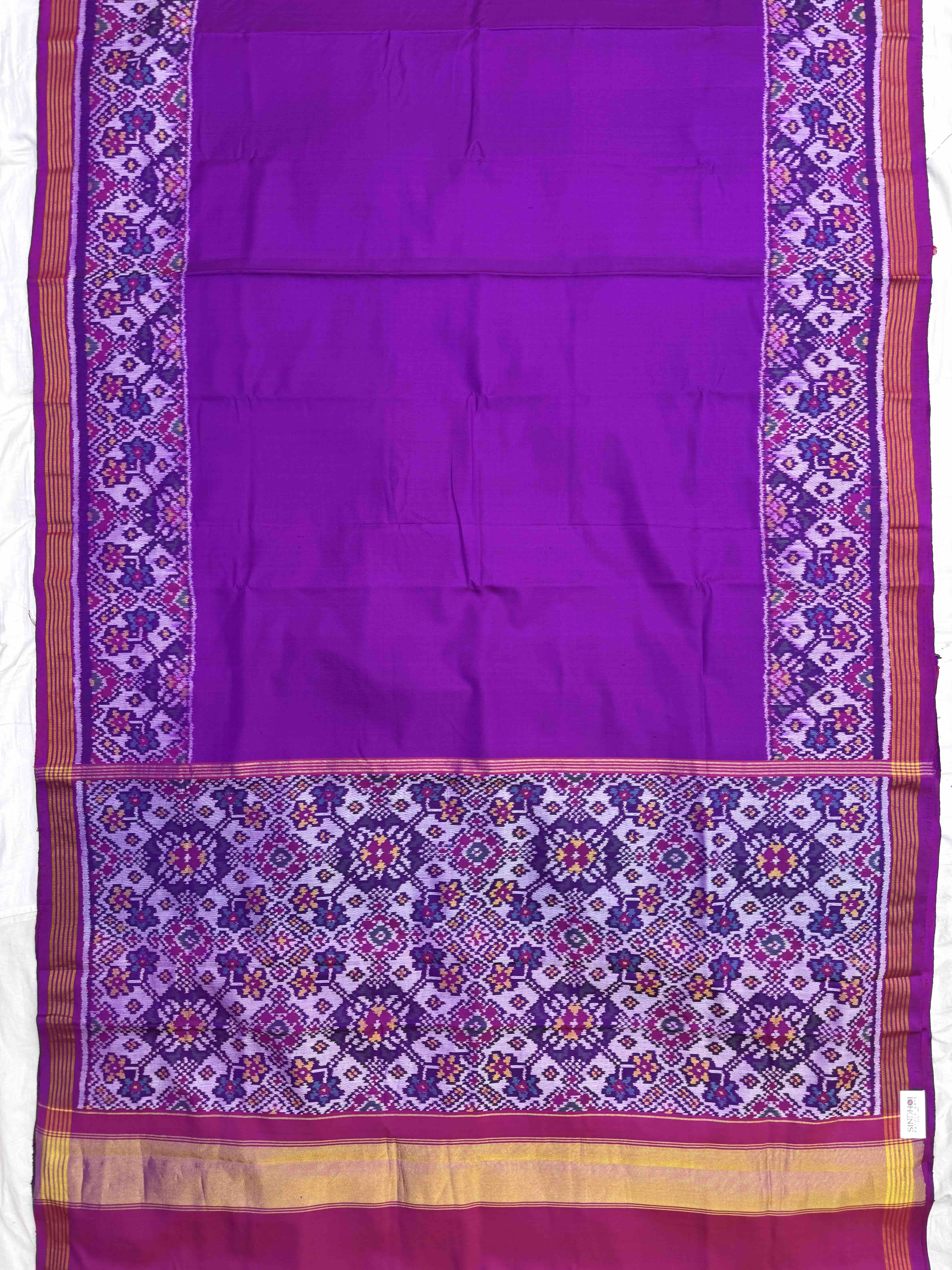 Purple Plain with Navratan Border Pallu Single Ikat Patan Patola Saree