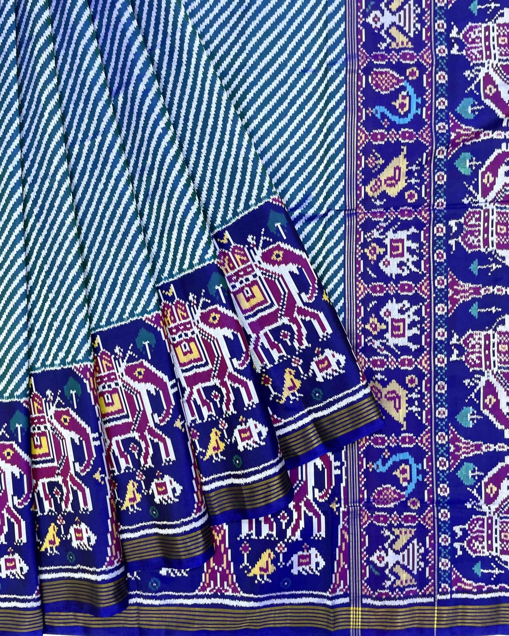 Blue & Turquoise Lining in White with Elephant Scut Border Patola Saree - SindhoiPatolaArt
