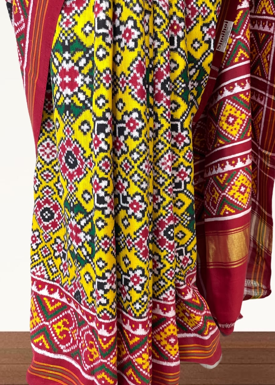 Yellow double ikat patola saree with navratna design - SindhoiPatolaArt