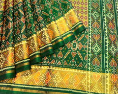 Green & Mustard Booty with Manekchowk Scut Border Patola Saree - SindhoiPatolaArt