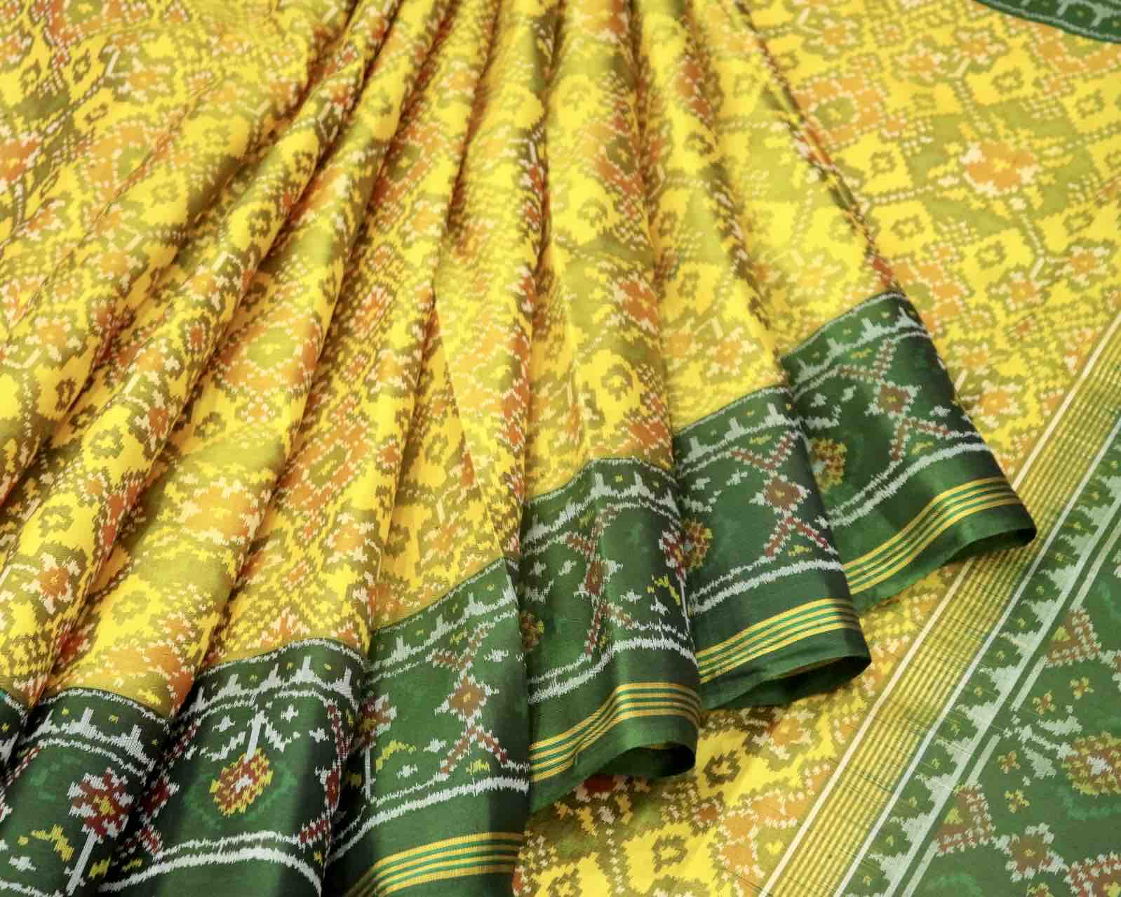 yellow navratna patola saree with green pallu - SindhoiPatolaArt