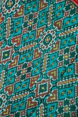 Semi double ikat dupatta in Green and Red colour with traditional Manekchowk design - SindhoiPatolaArt